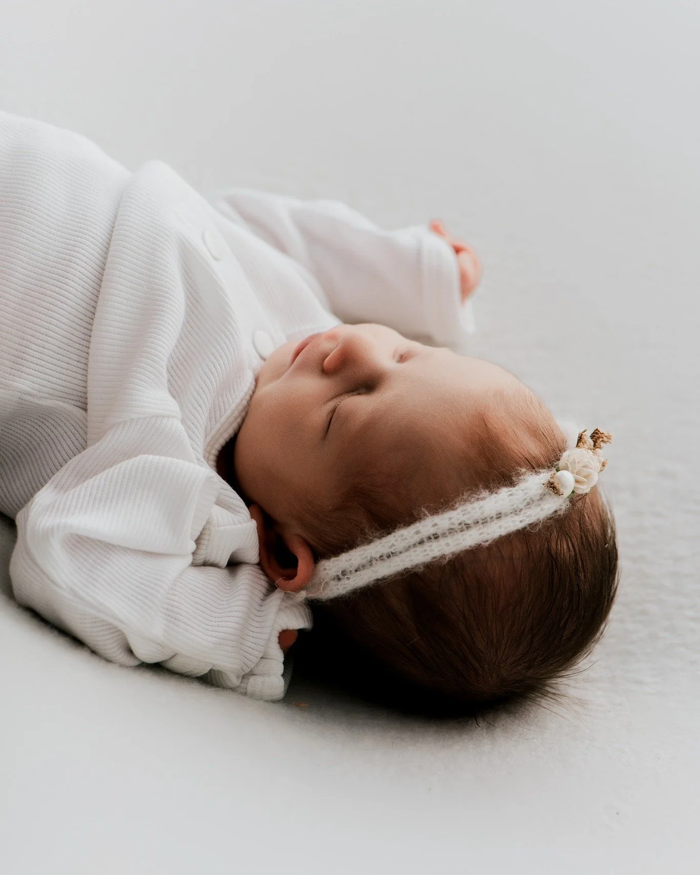 Tiny fingers grasping at adorable newborn outfits that are still far too big. Spiky little tufts of hair that only the lucky few seem to have in those early weeks. Perfect little pixie ears you could stare at for hours.
These are some of my favourite