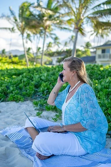 Suzy Seymour talking on phone at beach side