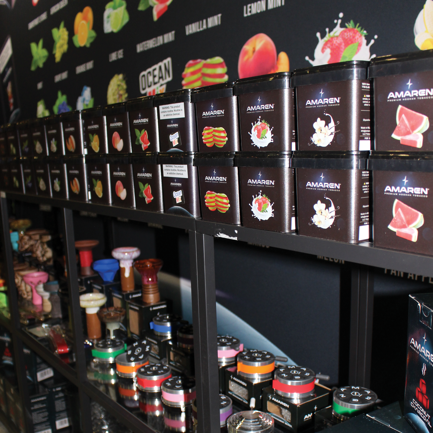 Display of Amaren premium hookah tobacco products with various flavors in a store.