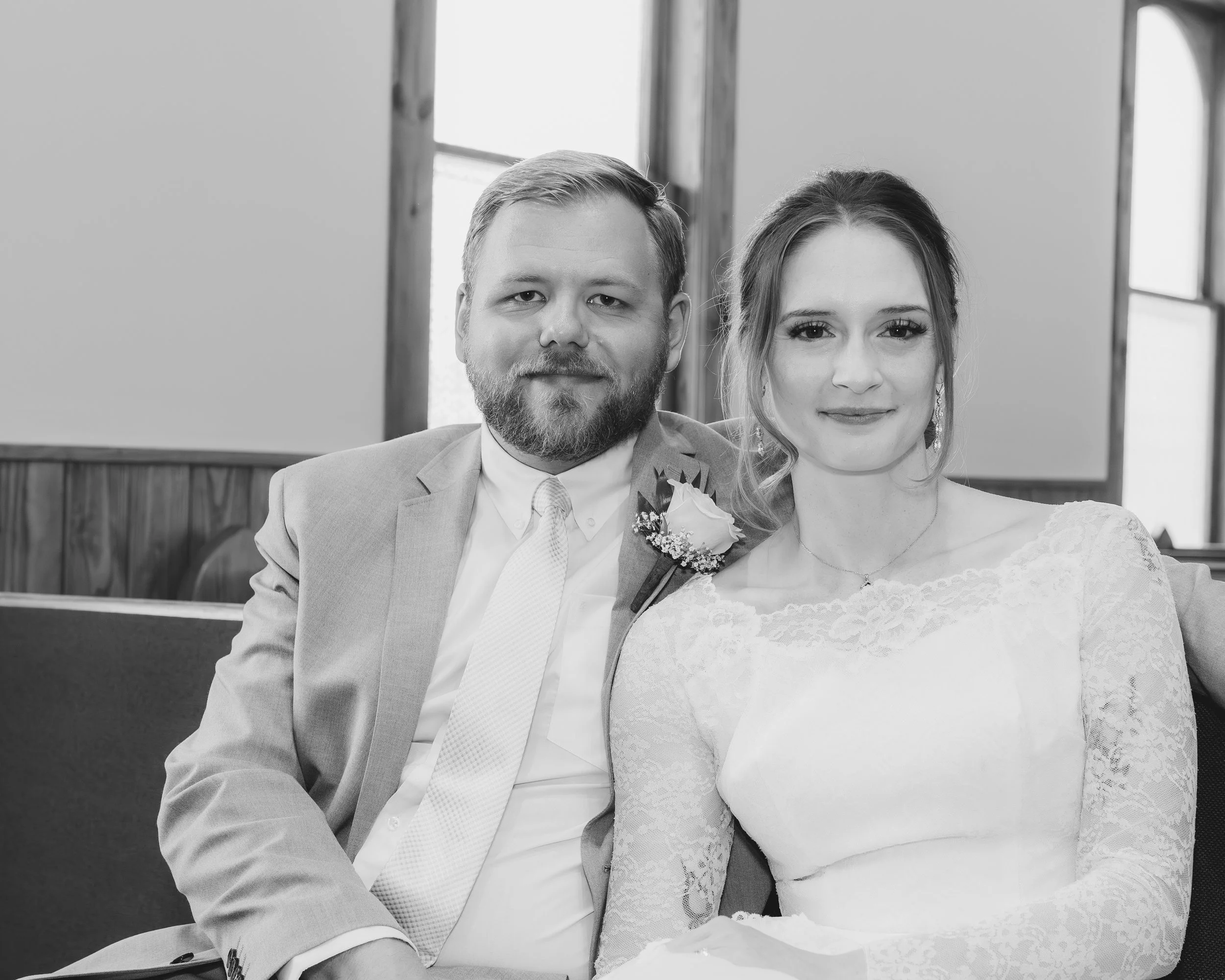 bride and groom on church pew