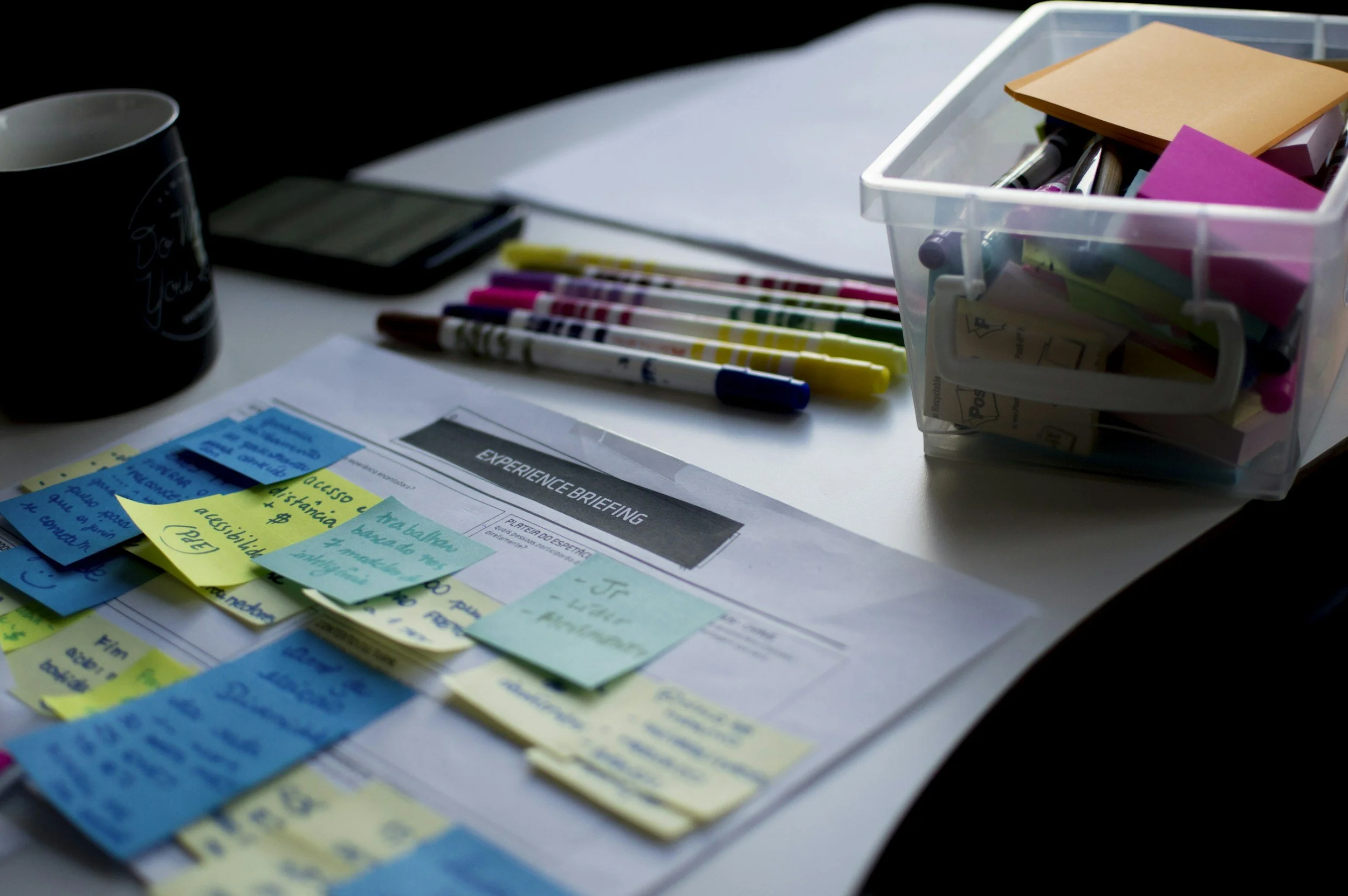 Desk with post its and items