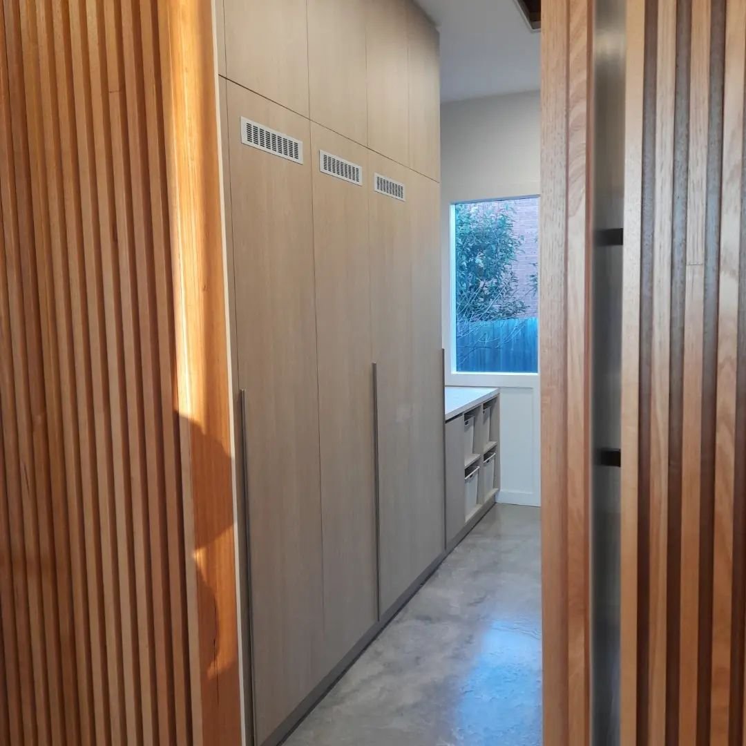 Project Halcyon. This enormous laundry fitted out in Polytec Coastal Oak. Has a drying cupboard with pull out drying rails to eliminate the clothes horse, has no excuse now for having wet clothes