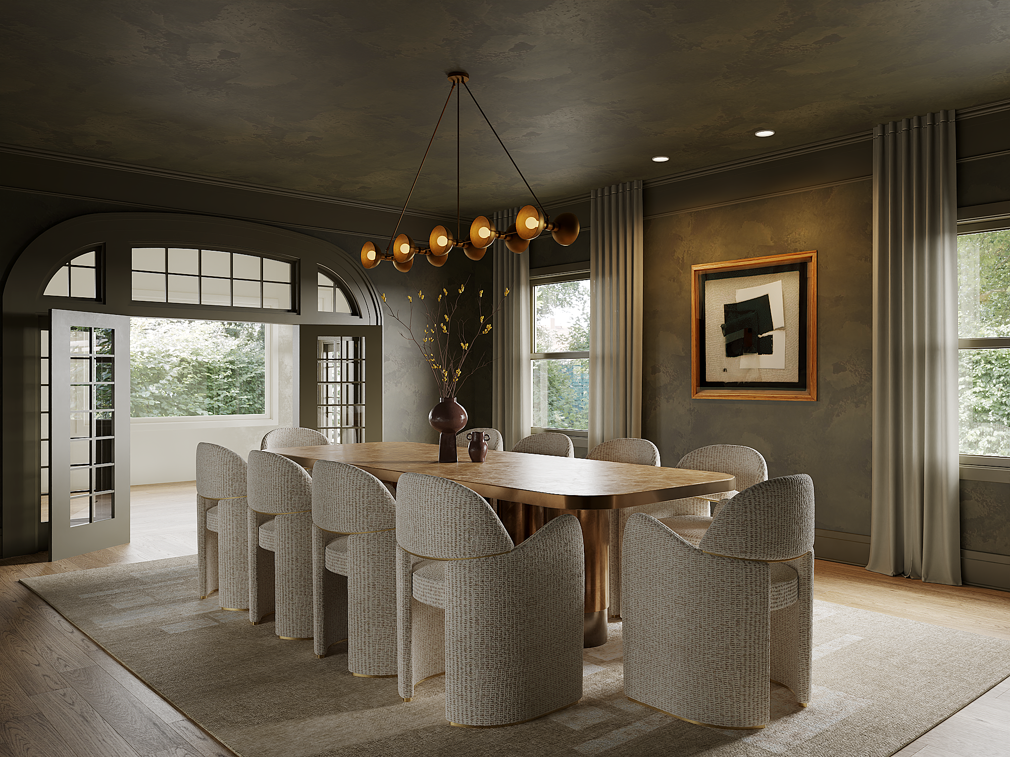 A dining room with a large wooden table surrounded by cushioned armchairs, a modern chandelier overhead, large windows with curtains, and a framed abstract artwork on the wall.