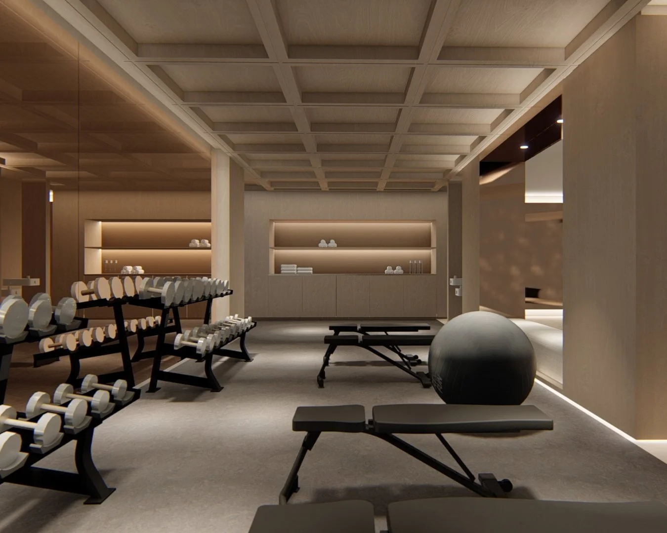 Modern gym with weight racks, exercise benches, a stability ball, and a massage table, featuring warm lighting and wooden accents.