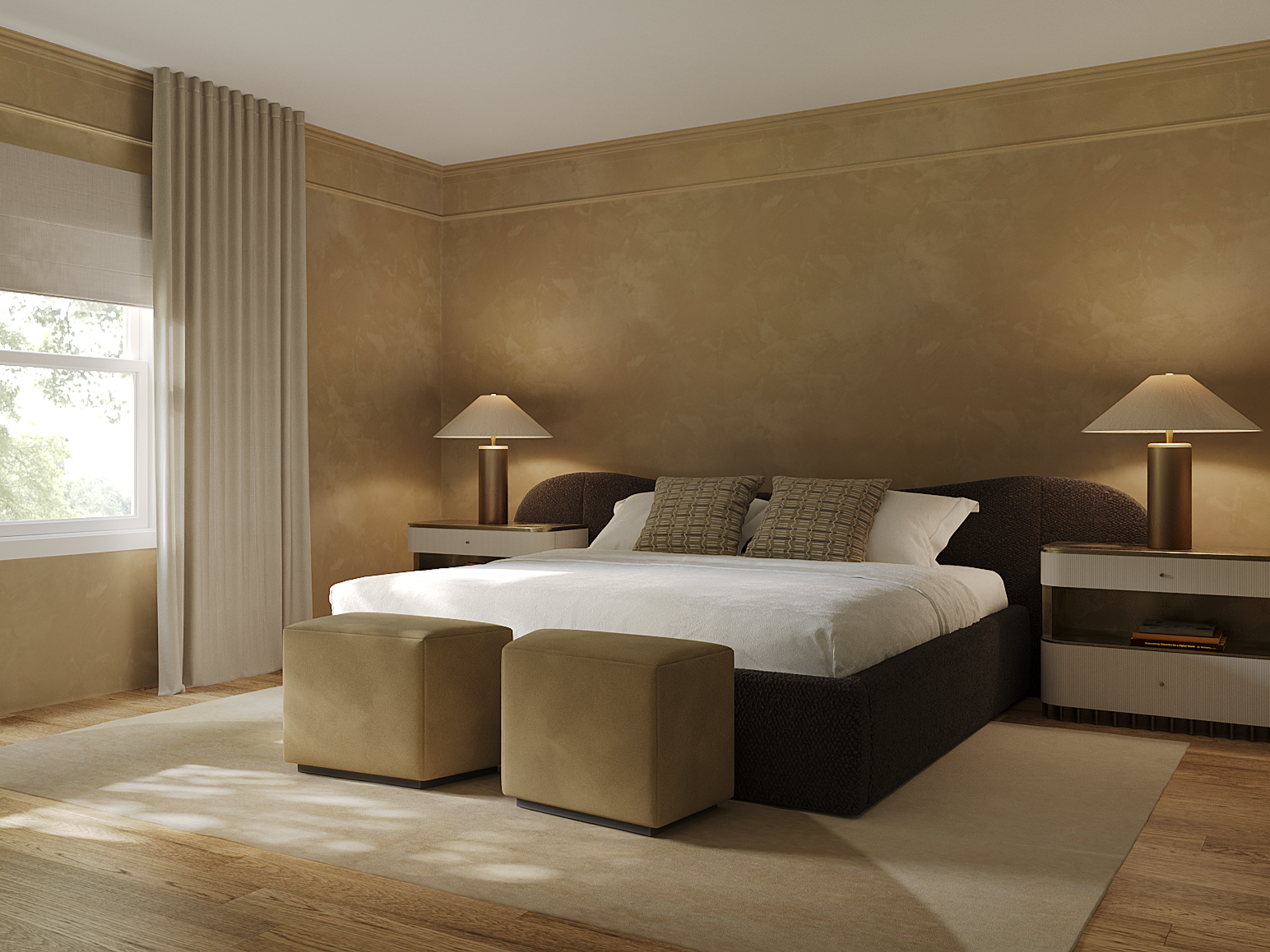 A bedroom with a bed, two nightstands with lamps, two beige ottomans, beige curtains, and a window showing outdoor greenery.