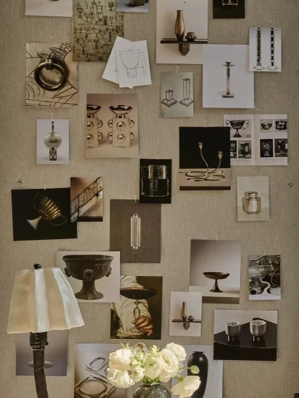 A collage of various interior design and decor images, including lamps, vases, shelves, bowls, and architectural sketches, pinned to a beige fabric background.