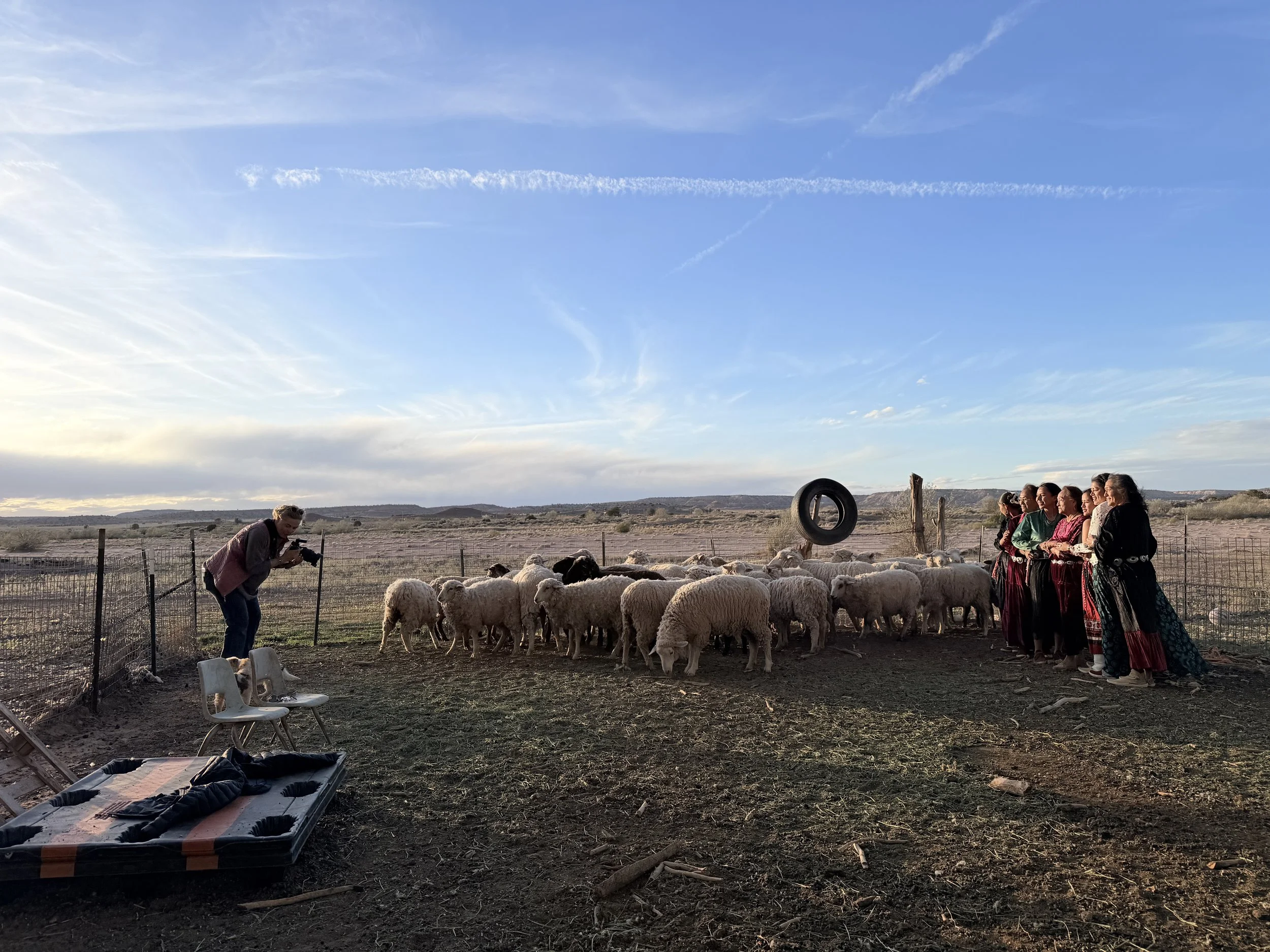 Behind-the-scenes image of Kim Brundage photographing NicoletteBehind the scenes of Kim photography multi-generations on family land in Ganado, Arizona for the Diné Women Empowerment Series.