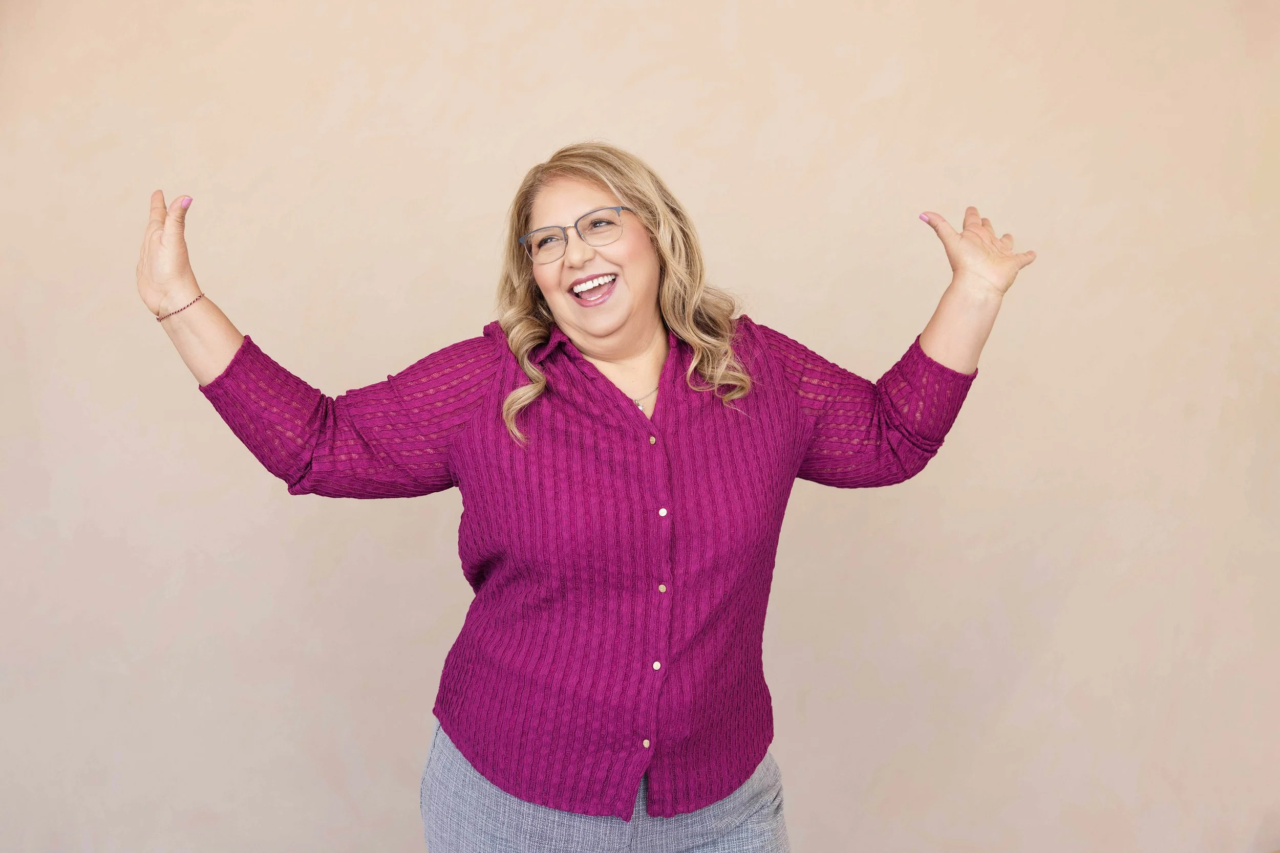 Middle aged woman, laughing and celebrating in Scottsdale, AZ