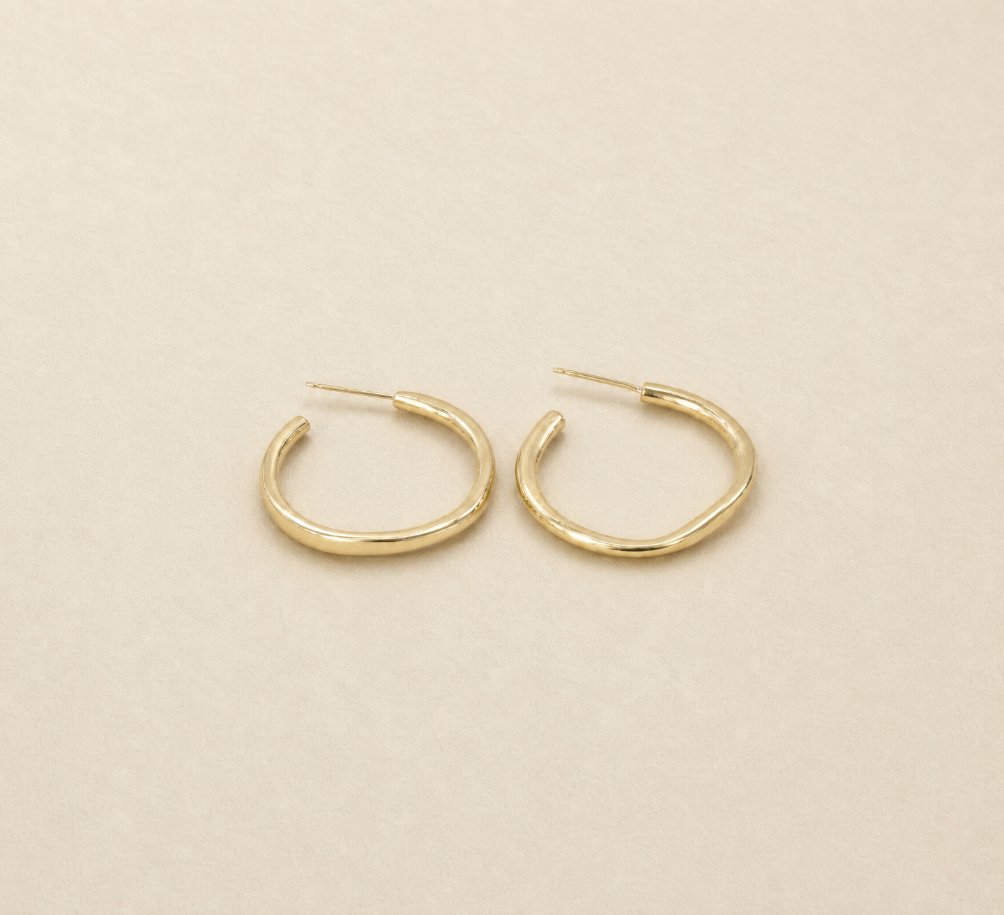 wavy earrings gold.png