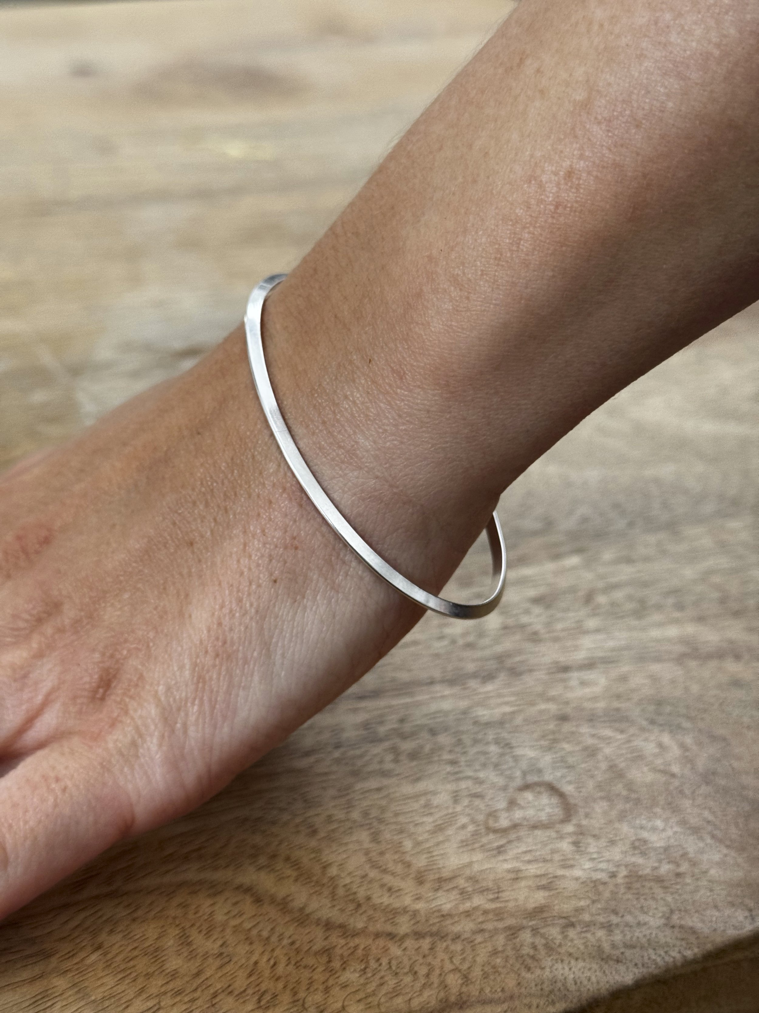 Leila silver oval bangle ridge minimal