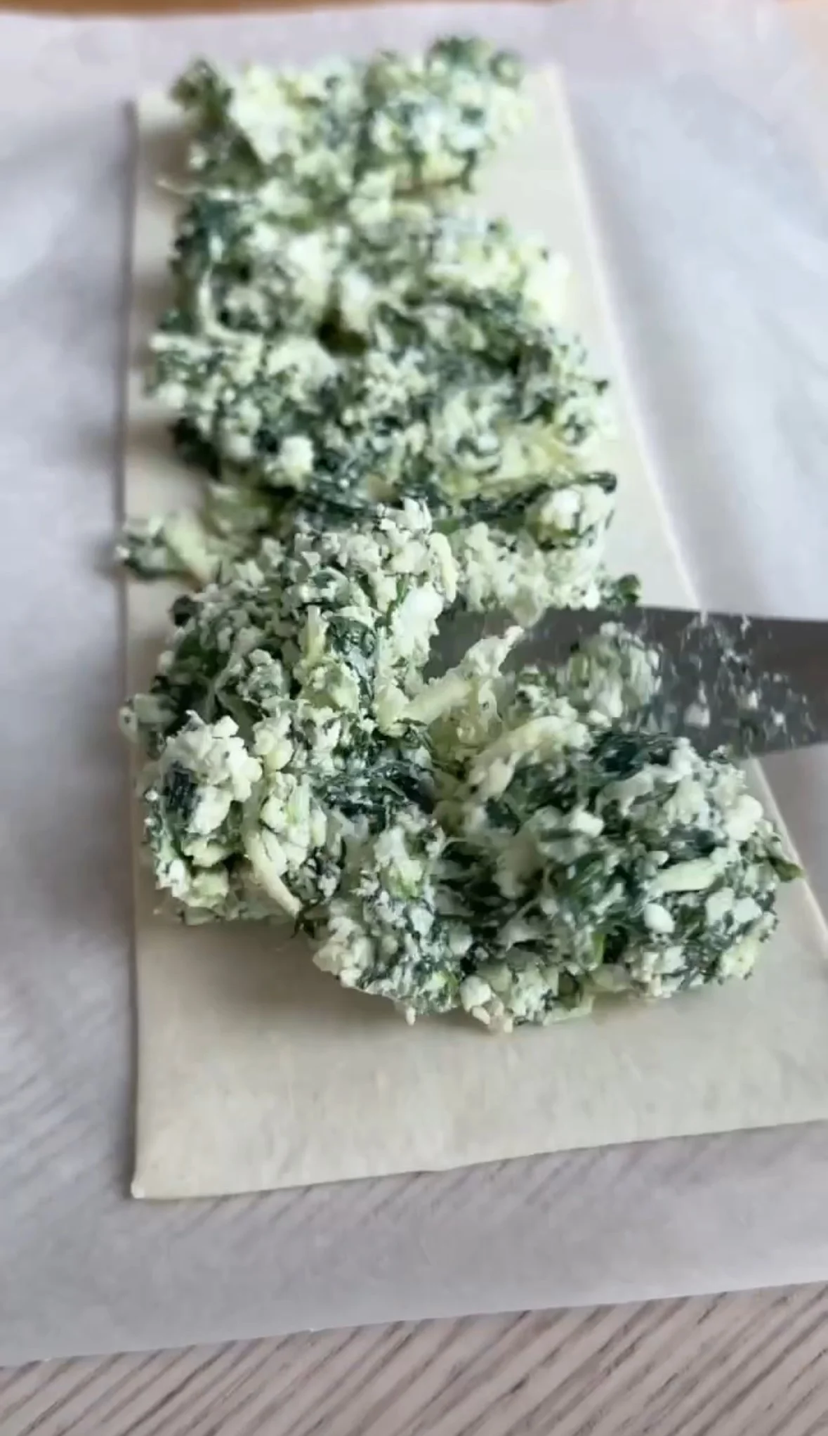 Kale chips on parchment paper.
