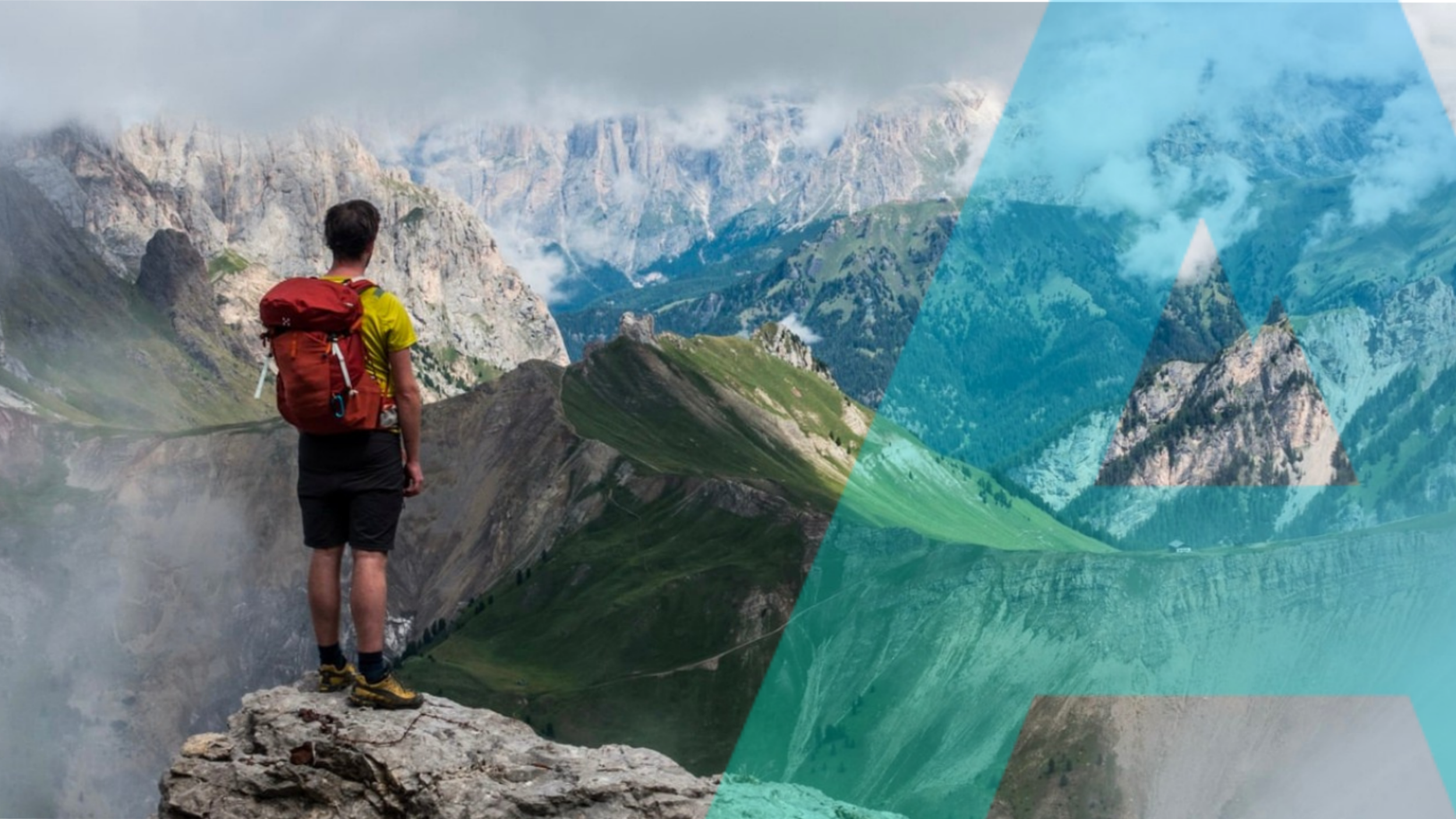 A man with a red backpack looking at mountains and a lake in a remote mountain landscape.