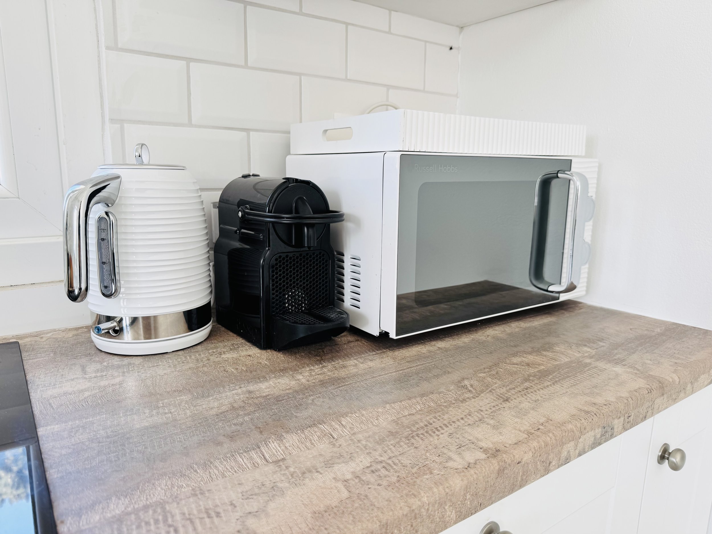 The Yellow House Kassiopi fully equipped kitchen including Nespresso coffee machine, Morphy Richards microwave, kettle and 4 slice toaster.