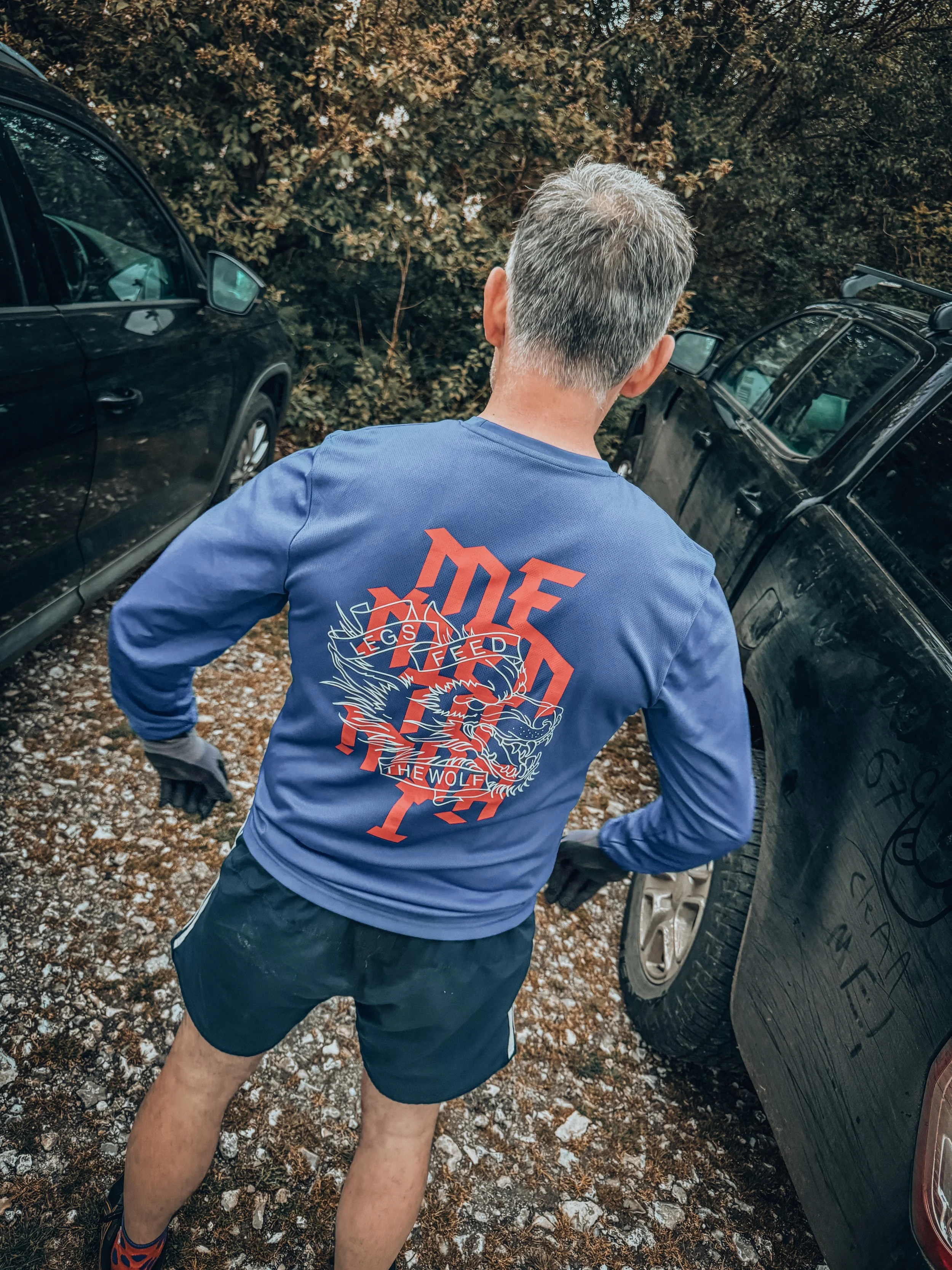 Men's Legs Feed the Wolf LS Tech-T