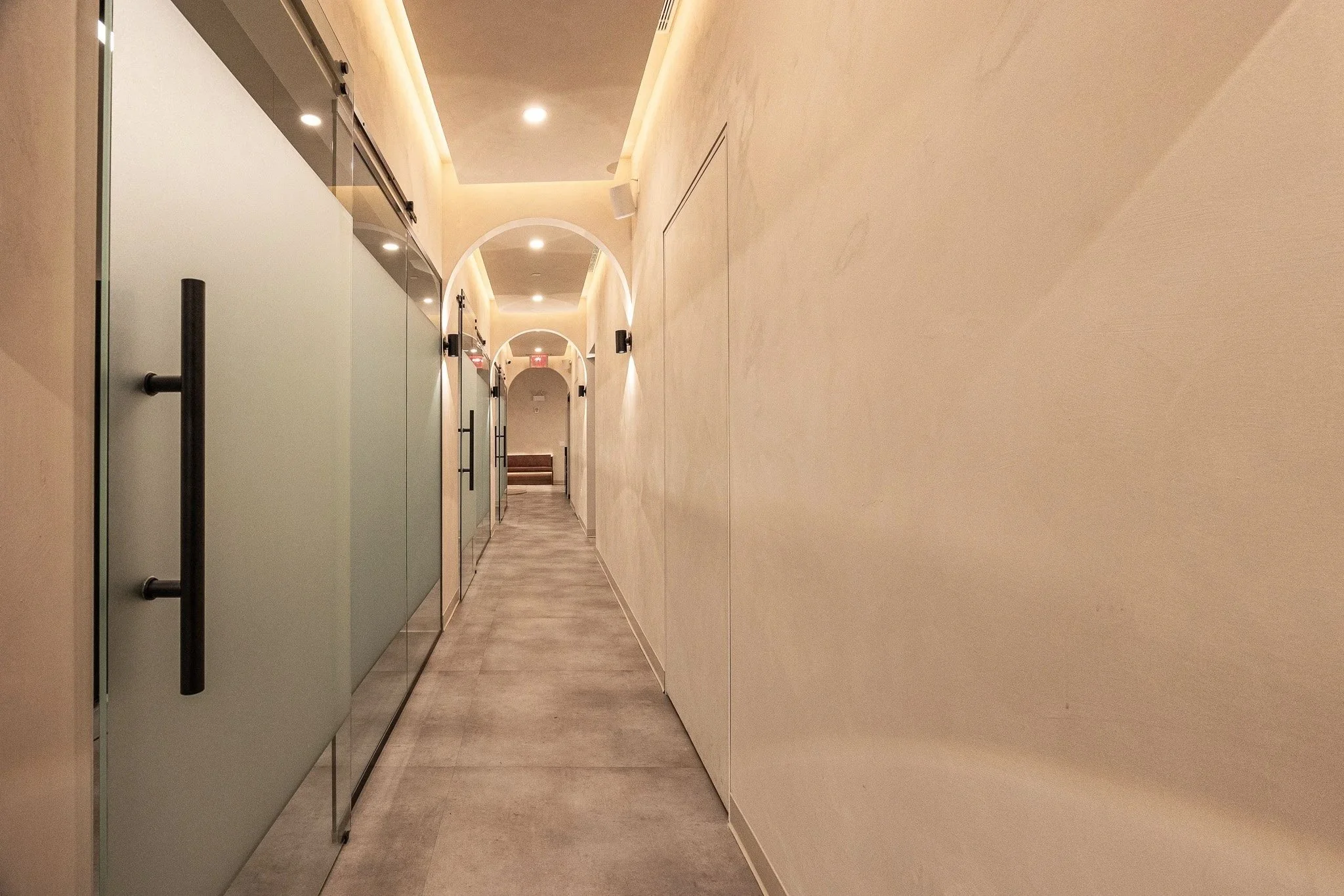Interior corridor at Polish Dental featuring clean architectural lines, warm finishes, and a contemporary healthcare design aesthetic.