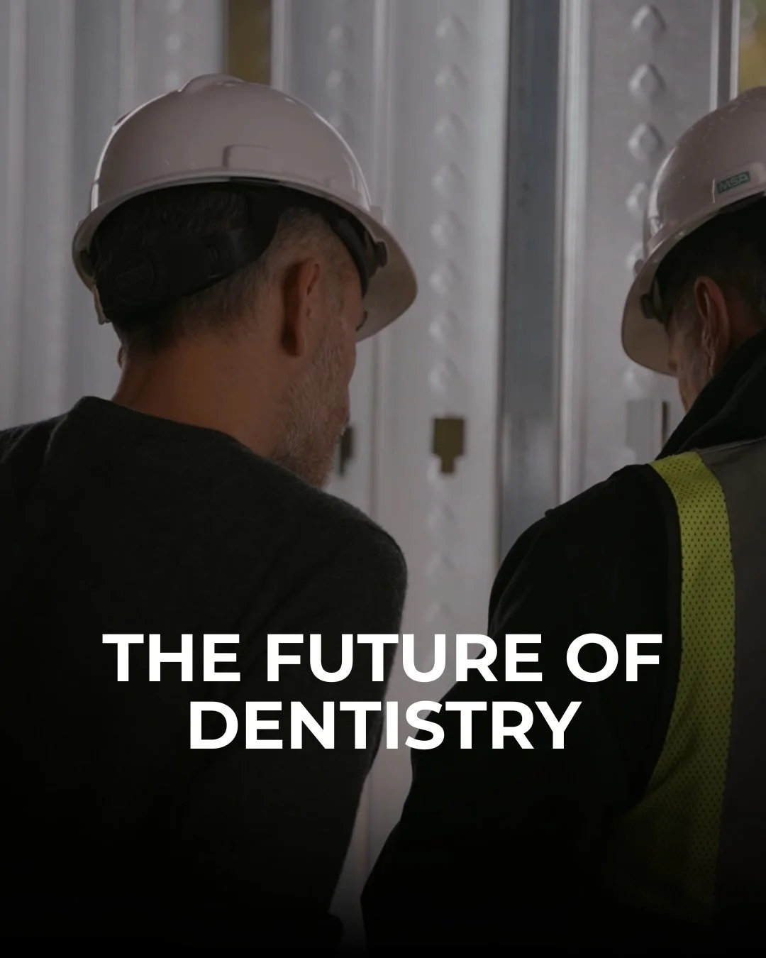 Two men wearing safety helmets looking at electrical panels, with text overlay "The future of dentistry."