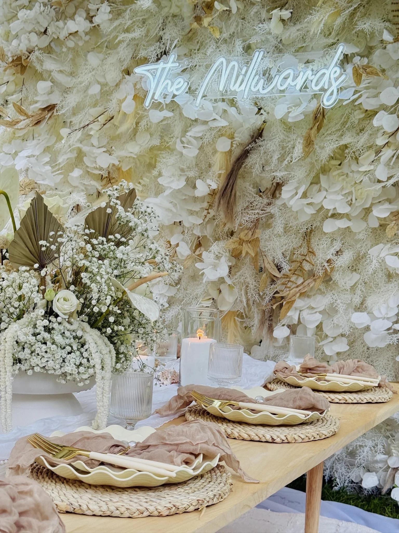 Outdoor bridal shower picnic with charcuterie boards and boho décor