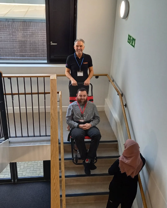 Evac chair in use on internal staircase