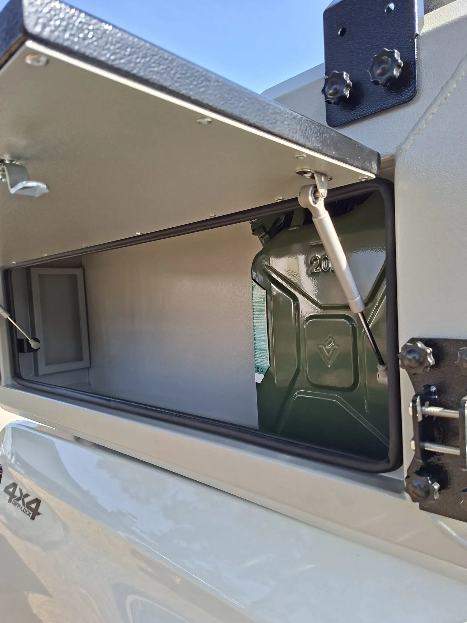 Demountable DEBOXS universal pickup storage system. Featuring integrated roof bars for roof cargo such as ladders, or rooftop tents, this rugged adventure and work canopy replacement offers a non-invasive mounting system that protects vehicle lease r