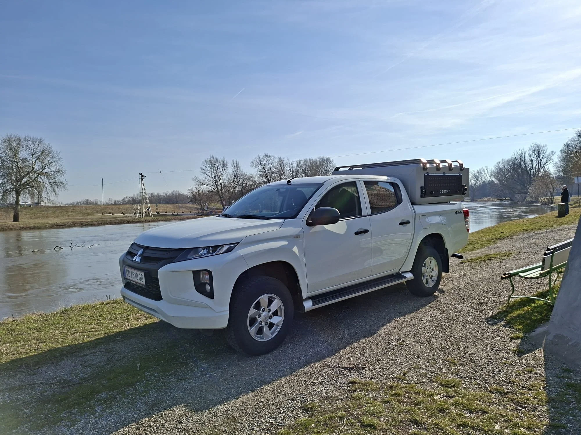 Demountable DEBOXS universal pickup storage system. Featuring integrated roof bars for roof cargo such as ladders, or rooftop tents, this rugged adventure and work canopy replacement offers a non-invasive mounting system that protects vehicle lease r