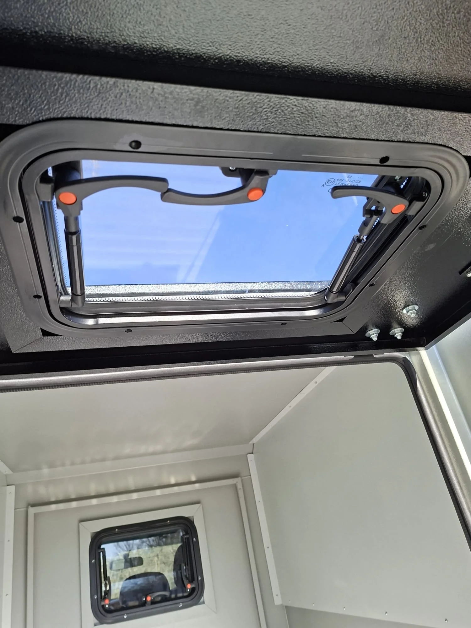 Demountable DEBOXS universal pickup storage system. Featuring integrated roof bars for roof cargo such as ladders, or rooftop tents, this rugged adventure and work canopy replacement offers a non-invasive mounting system that protects vehicle lease r