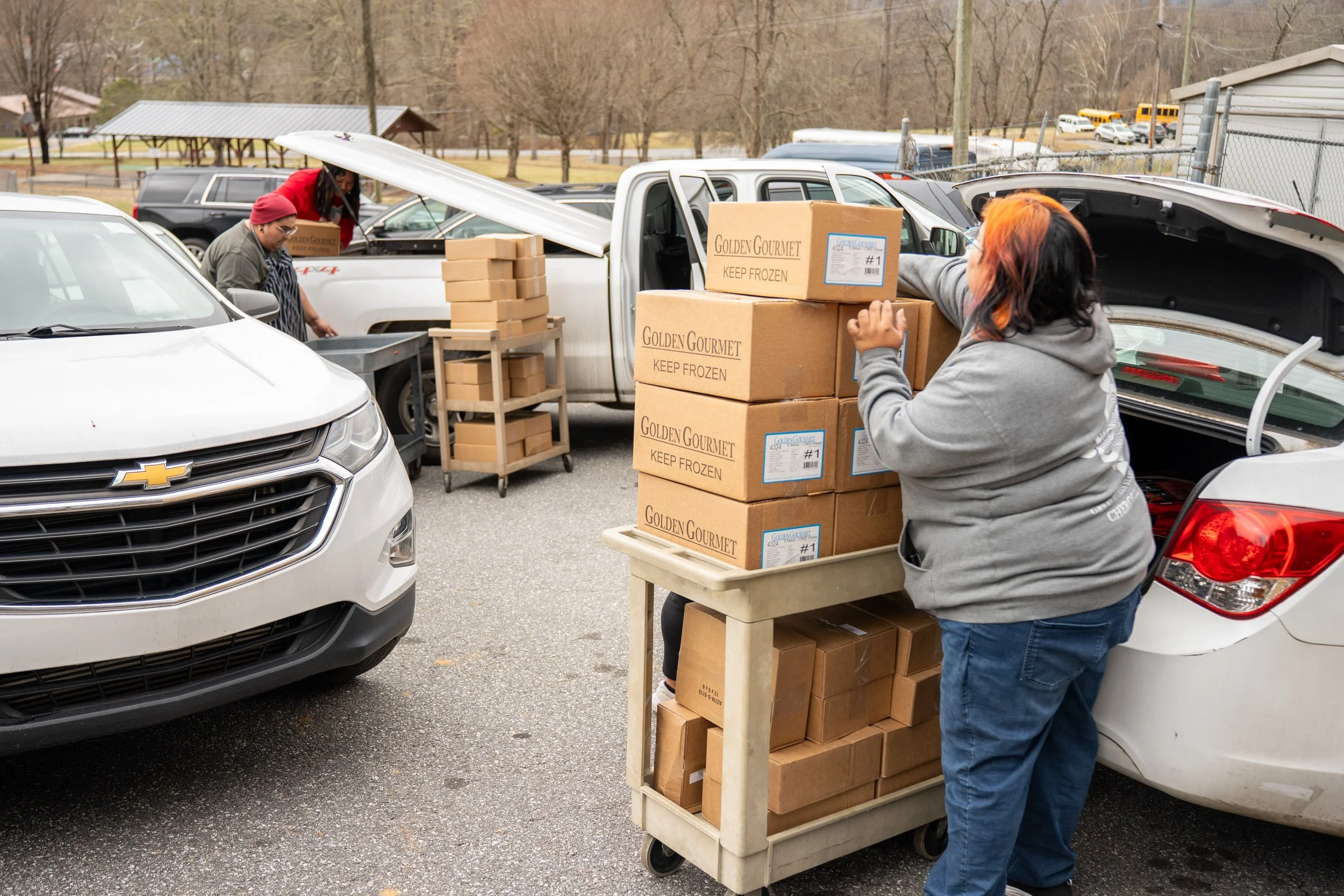 person getting food boxes