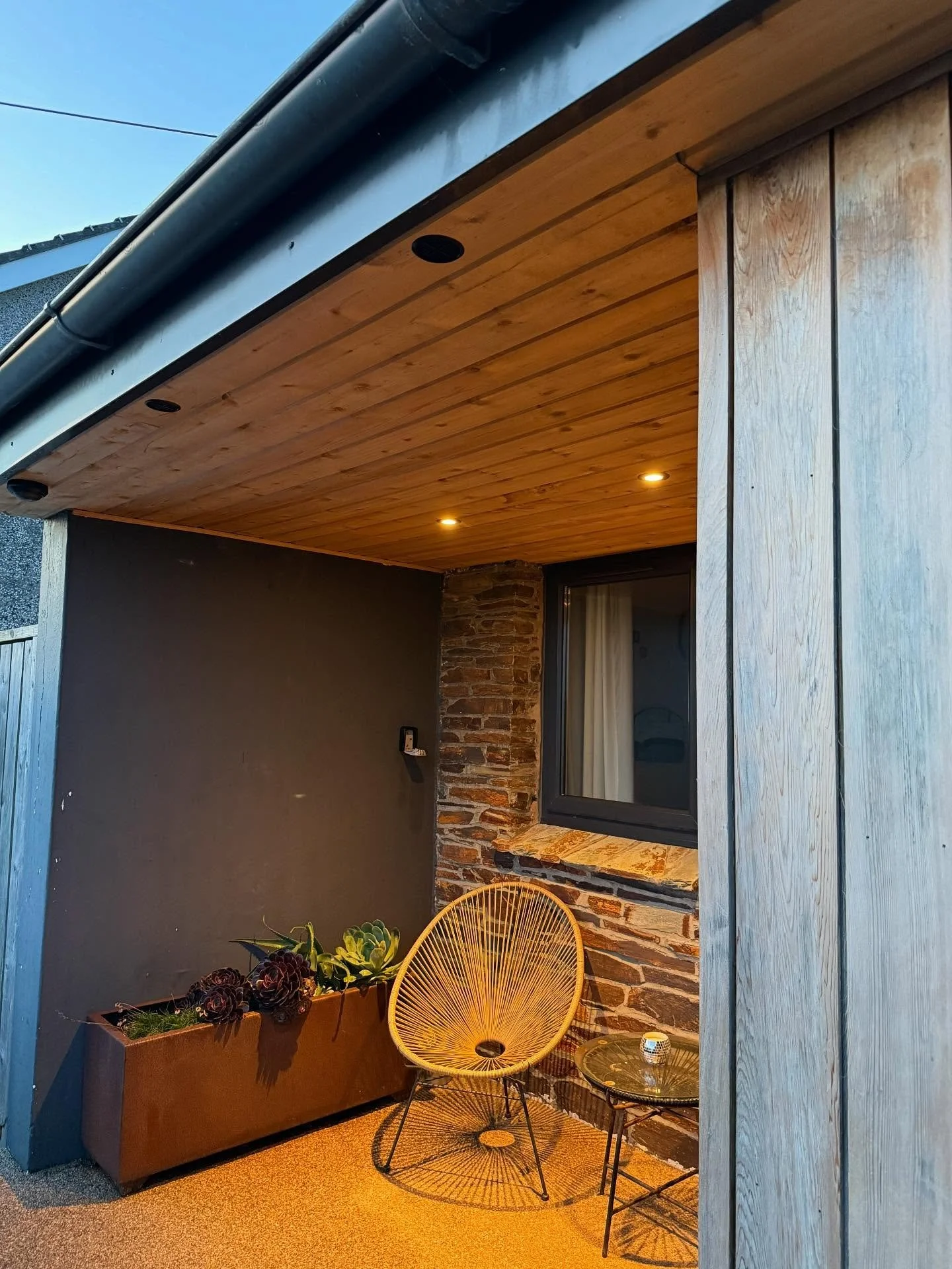 From plastic to cedar!! 

Brand new cedar soffit and spotlights on a sensor for this customer in mawgan porth. 
We also Sanded down the existing cedar cladding aswell bringing it back to life.