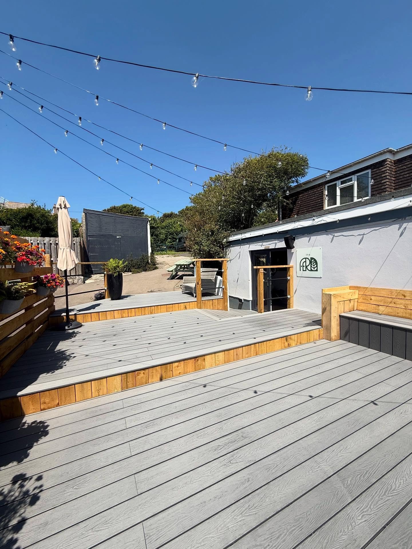 Stone grey strikes again!
This one was a complete space changer
- Three tier decking
- Ramp into the bar
- Black scaffold handrails
- built in bench seat
And lighting to keep the bar open till late

Head down to @thefern.perranporth to enjoy and cock
