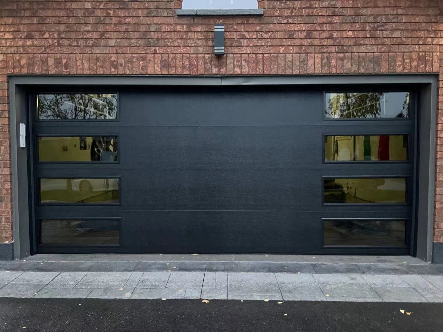 black-matte-garage-doors-with-modern-layout-windows.jpg