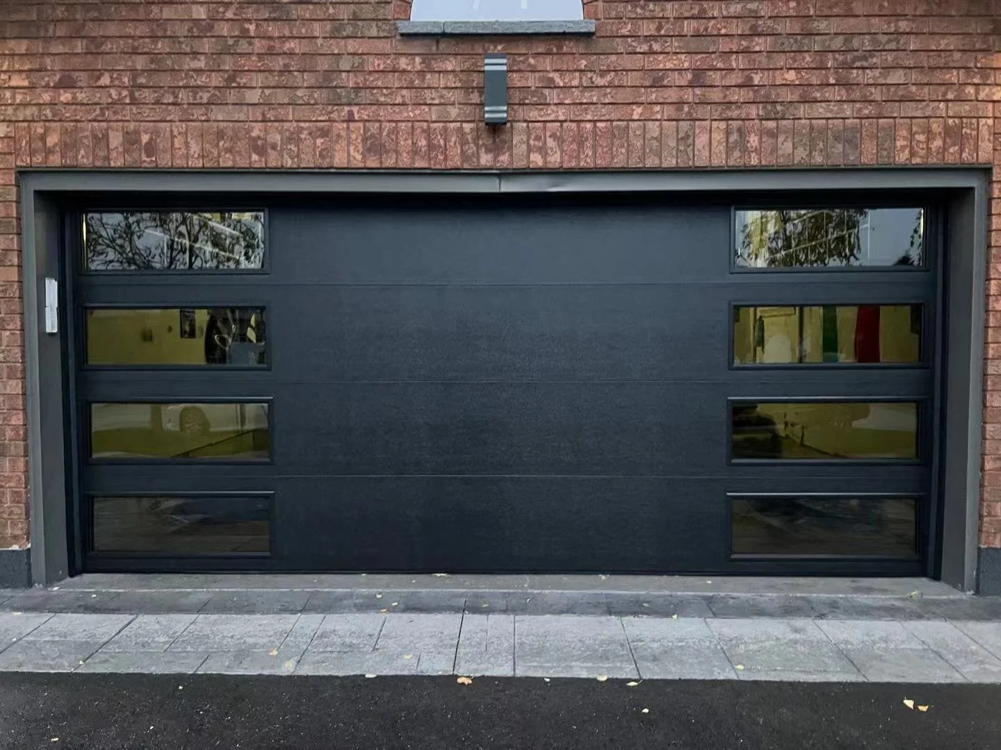 black-matte-garage-doors-with-modern-layout-windows.jpg