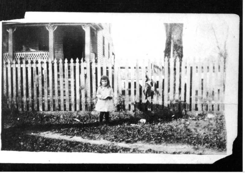 Child in front of Crumpler-Spady house