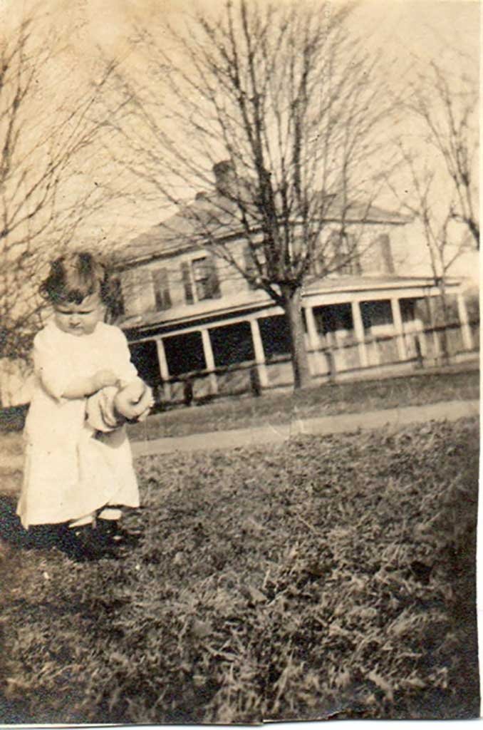  Judith Gilliam in the front yard of her grandparents with her home in the background Gilliam  family photo 