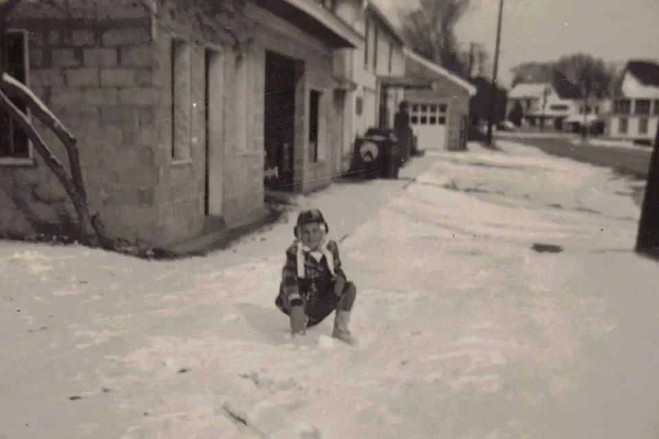 Jack Knight in front of home next to Saunders Supply Co. Notice the background.  Knight family photo 