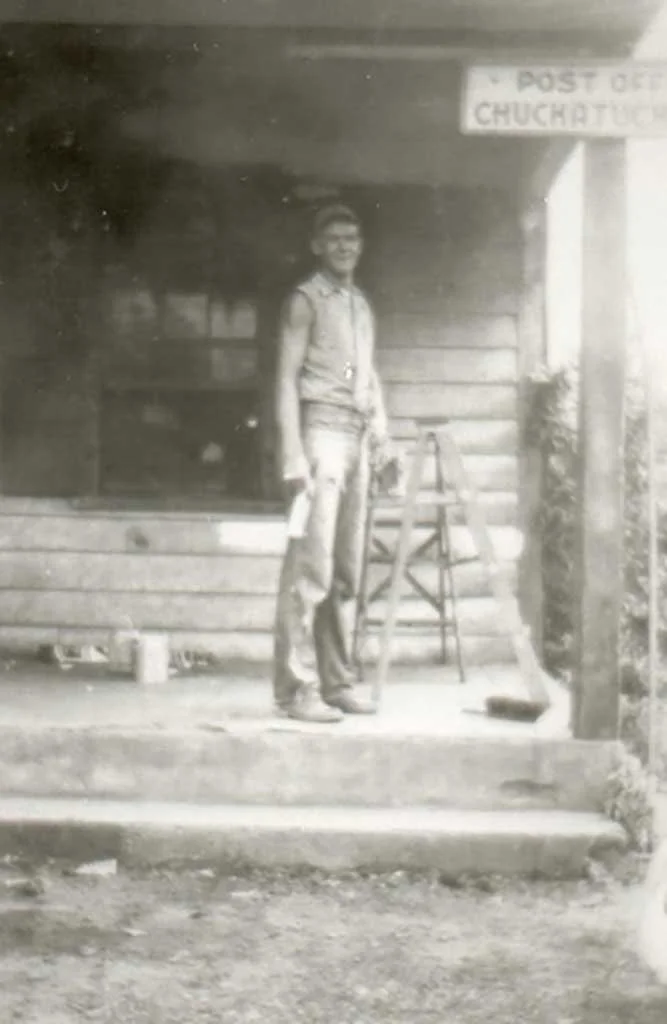  W.C. (Billy) Moore, Jr. on the front porch of Moore’s Store  Notice the post office sign.  Moore family photo 