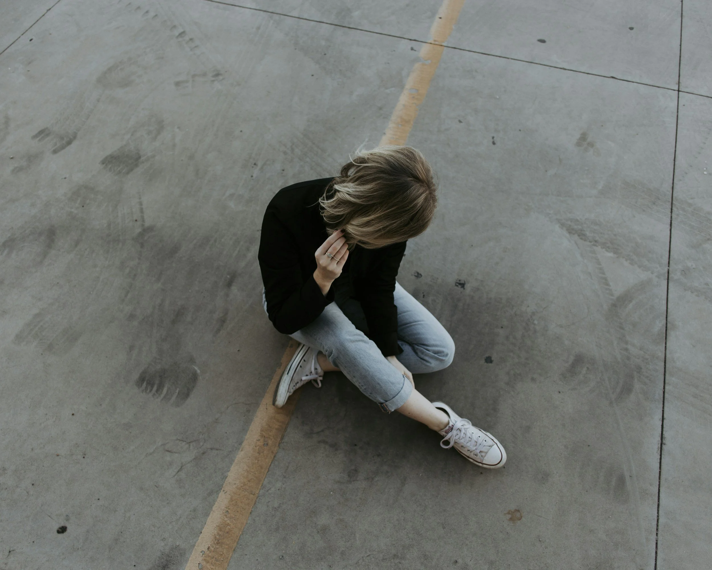 A woman with ADHD who suffers from Rejection Sensitive Dysphoria, a tendency to fear and react strongly to rejection, real or percieved, due to her emotional and executive function struggles and history of being criticized