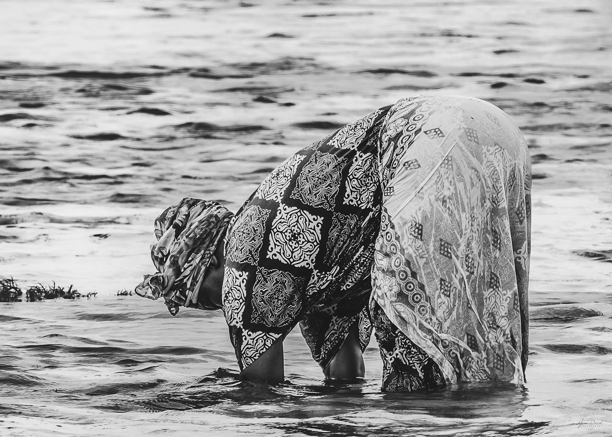 WOMAN AT WORK - What it takes, every single day, first thing in the morning, for these ladies from the eastern shore of Zanzibar to stack bags upon bags of seaweeds destined both for family consumption and nearby commercial endeavors should probably 