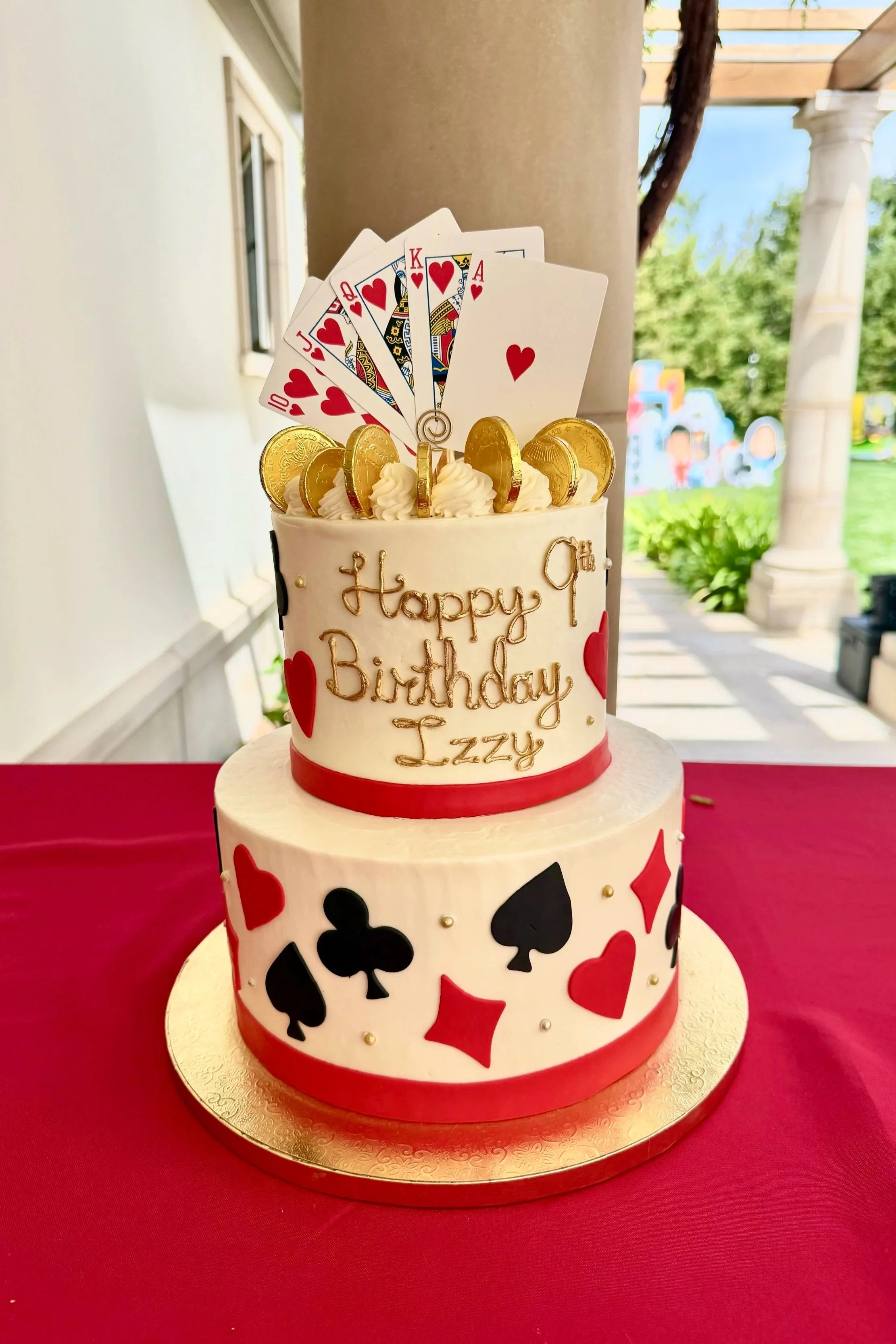 poker cake with playing card topper and gold inscription