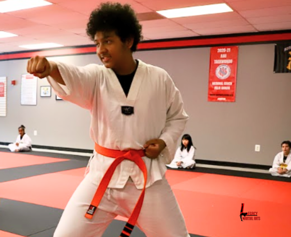 Beginner martial arts student practicing a punch at Legacy Martial Arts Silver Spring MD