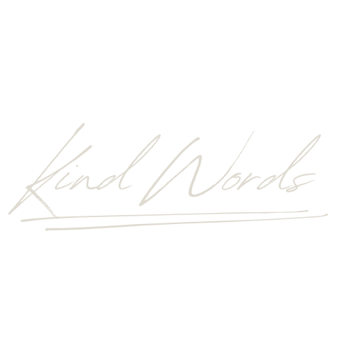 The phrase "Kind Words" written in elegant, cursive script with a white underline on a black background.