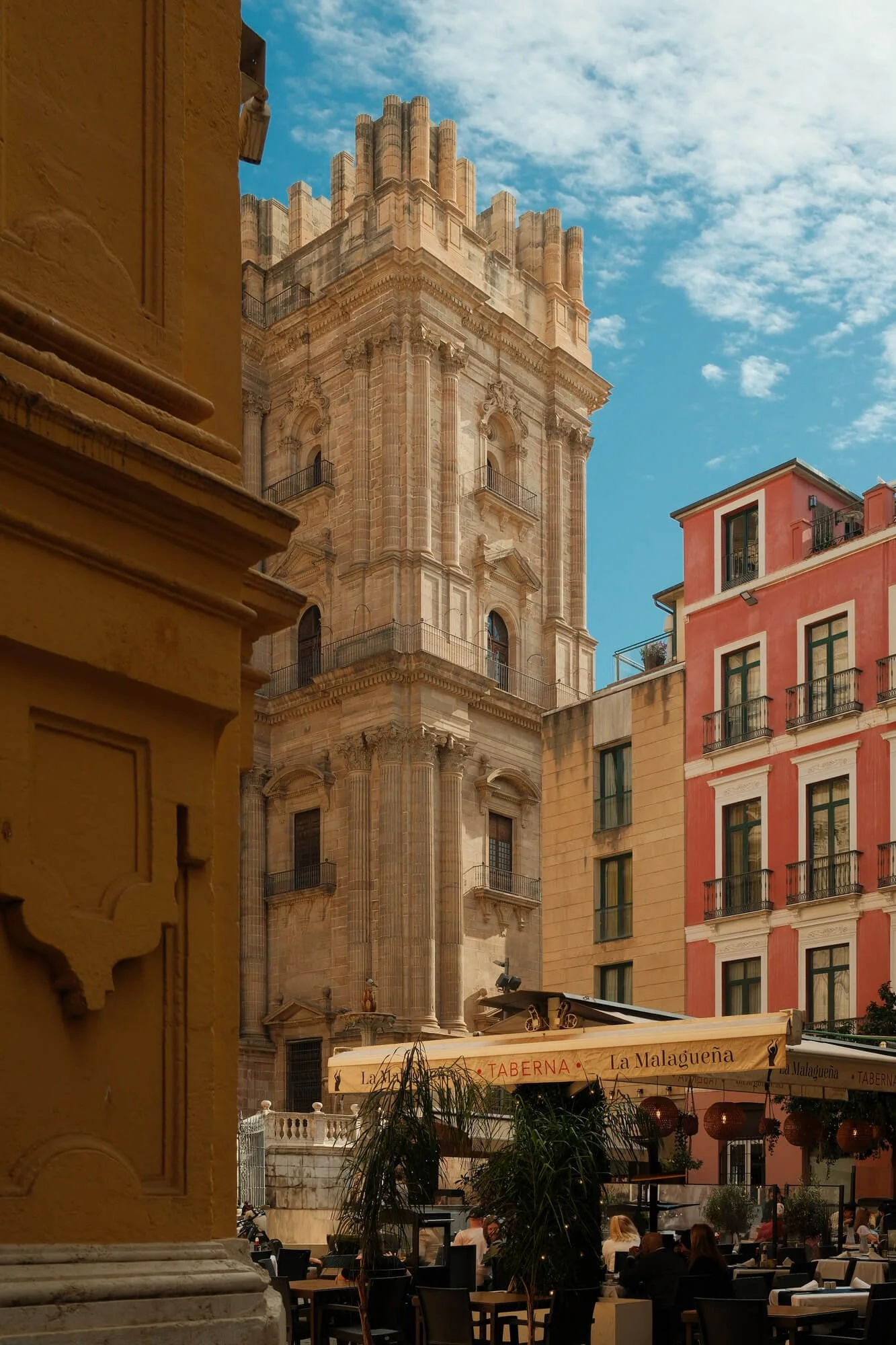 online therapy for expats - old architecture in Europe with people sitting at cafe