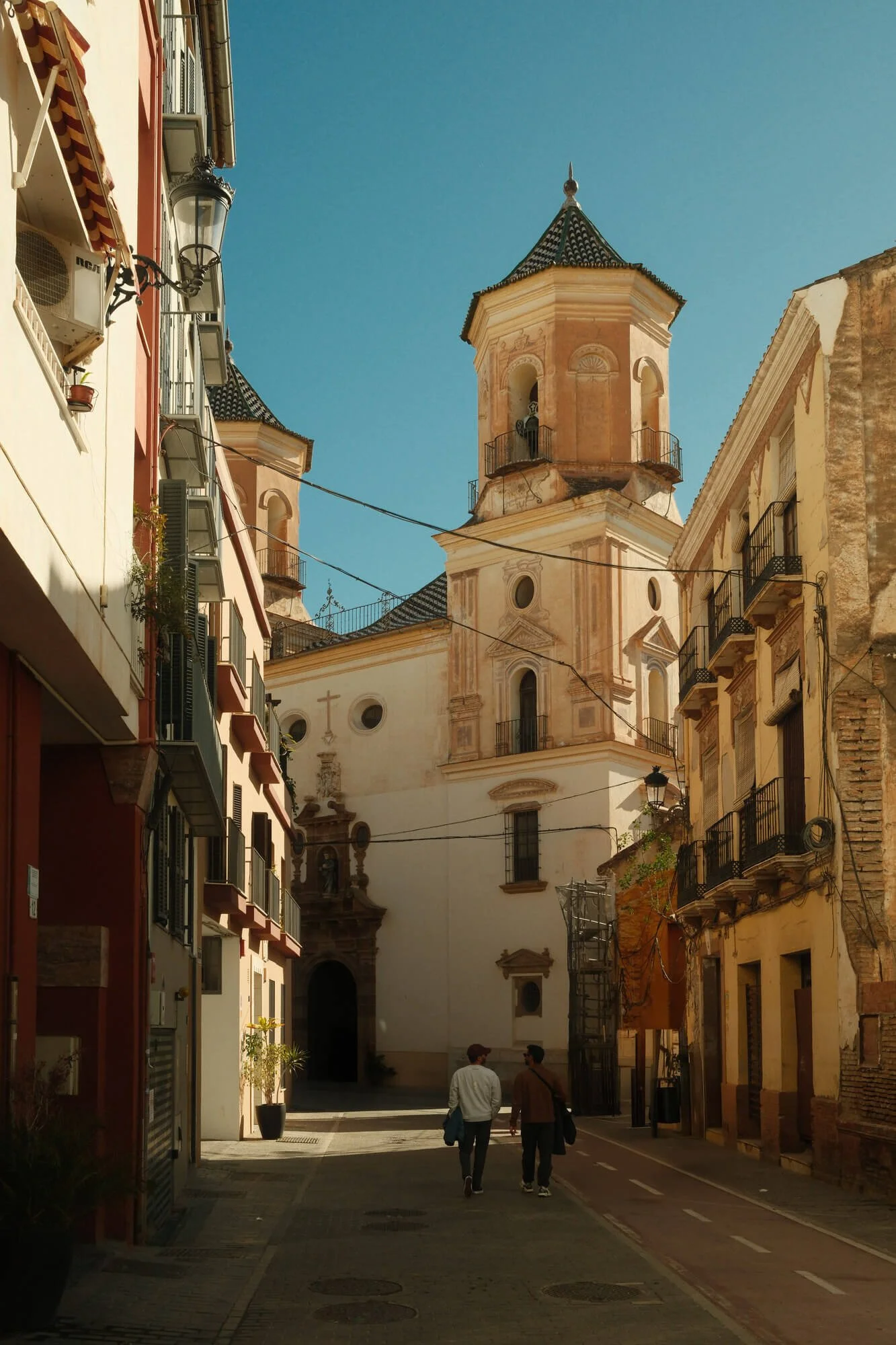 old city center in europe couple waling along the street