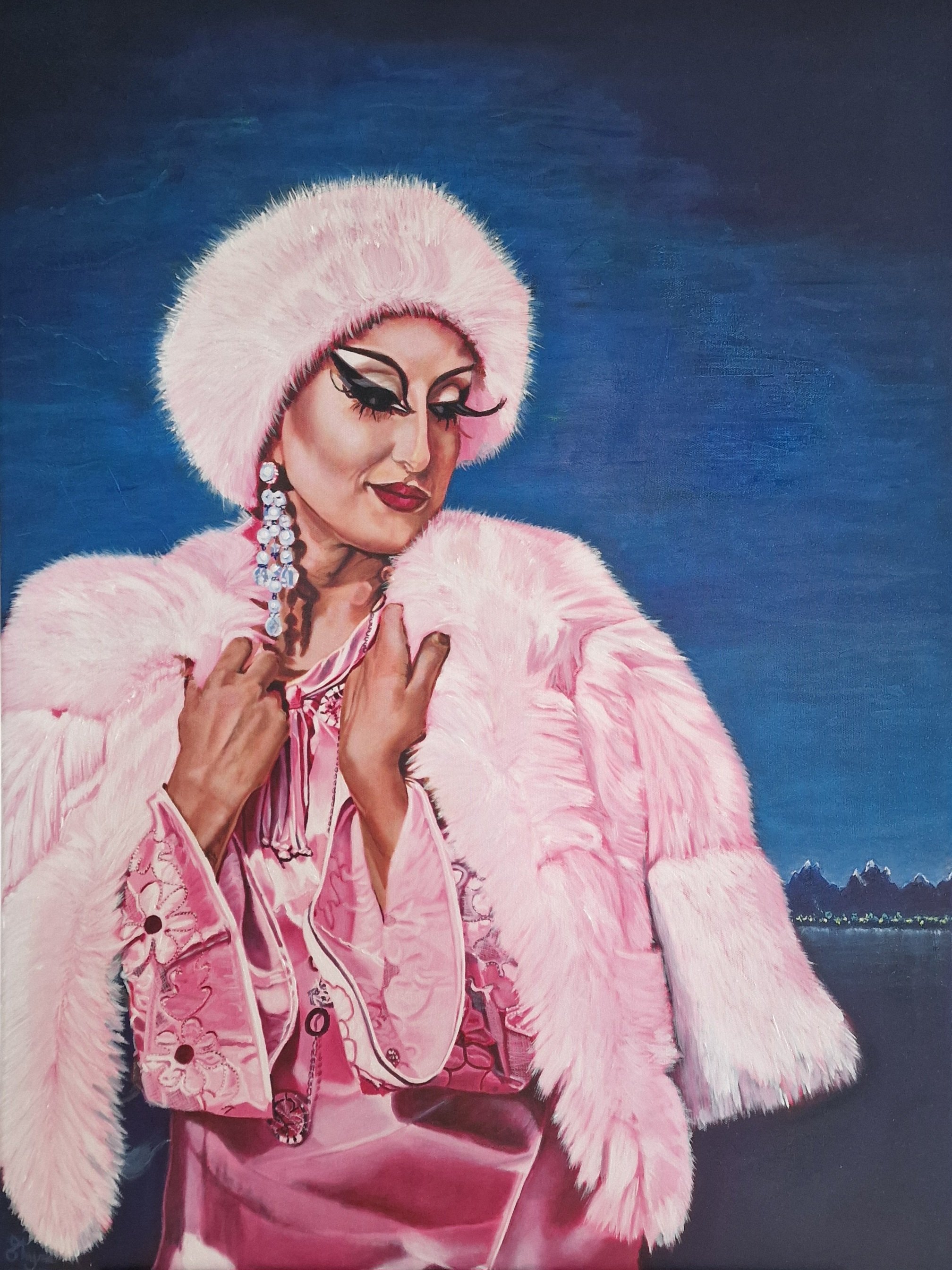 A woman with elaborate makeup and long eyelashes wearing a large pink fur hat and pink fur coat, standing against a dark blue sky and landscape background.