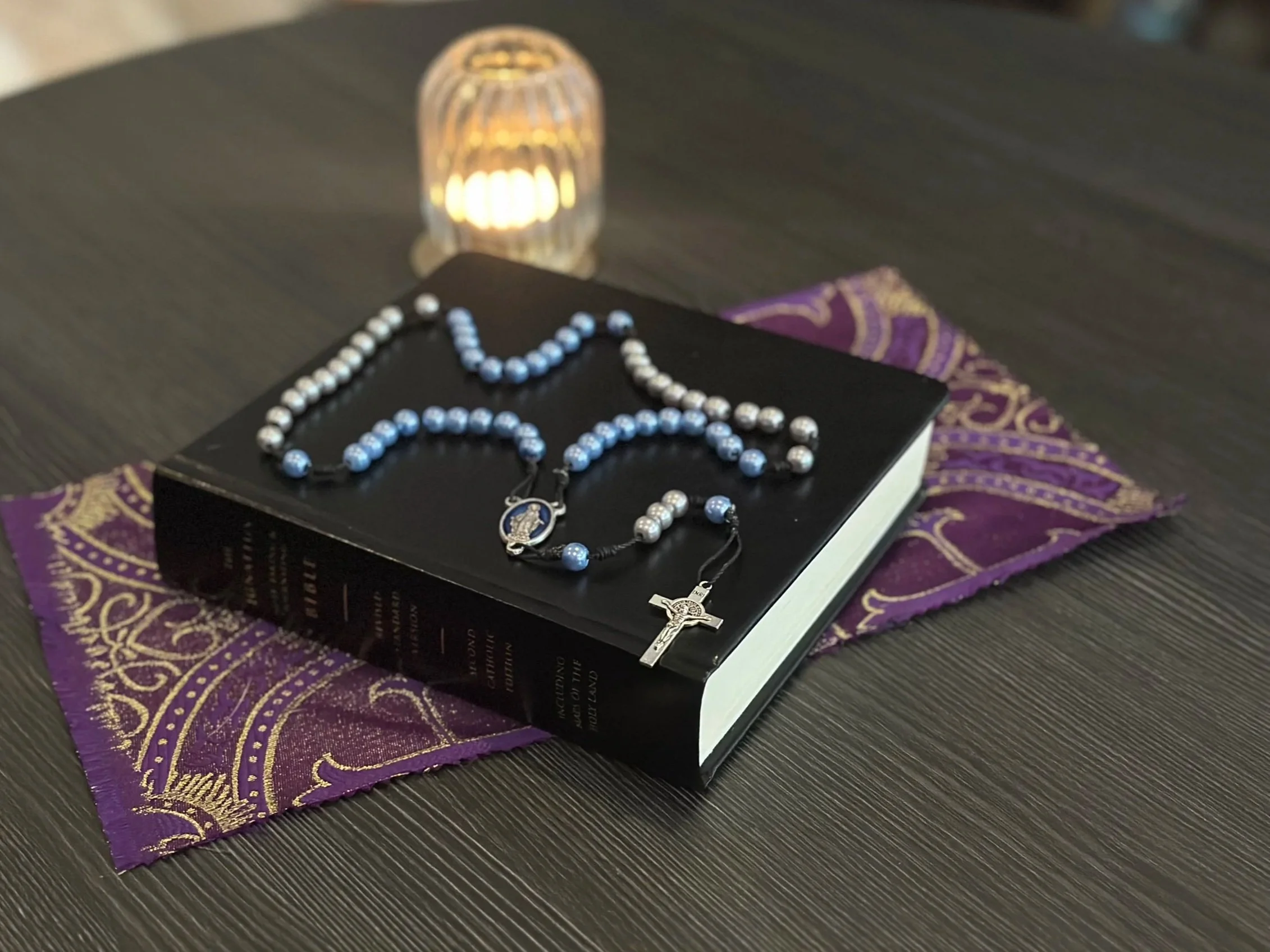 The Starlight Reflection Rosary on black cord with blue and silver glass beads for somatic grounding.