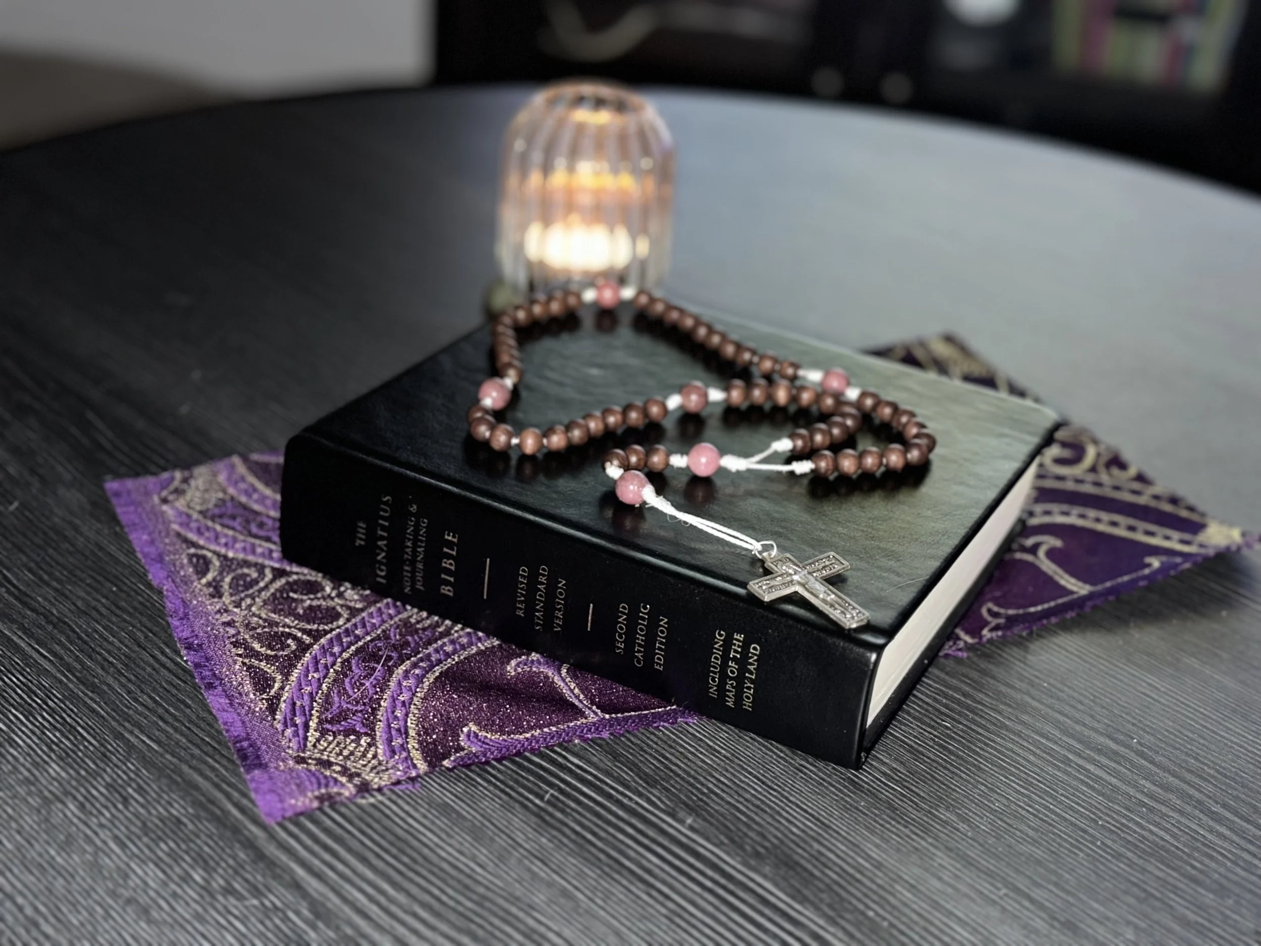 The Earth & Anchor Rosary with natural olive wood beads on a clean white cord for somatic grounding.
