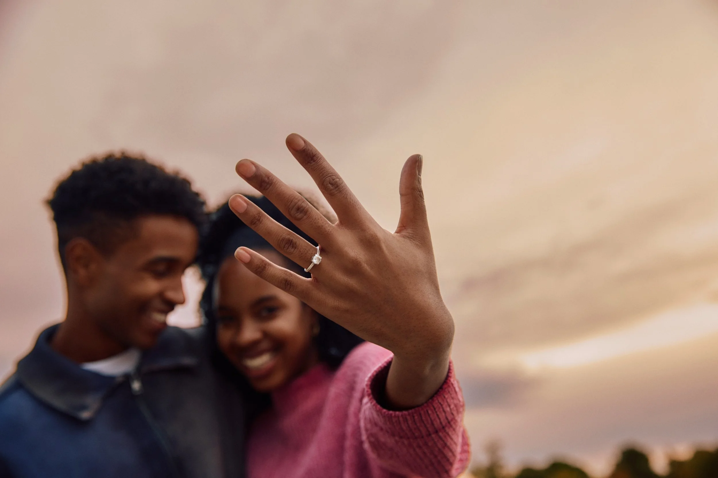 A happy couple who is recently engaged in Houston is ready to start self-guided premarital preparation as outlined by Heights Couples Therapy.