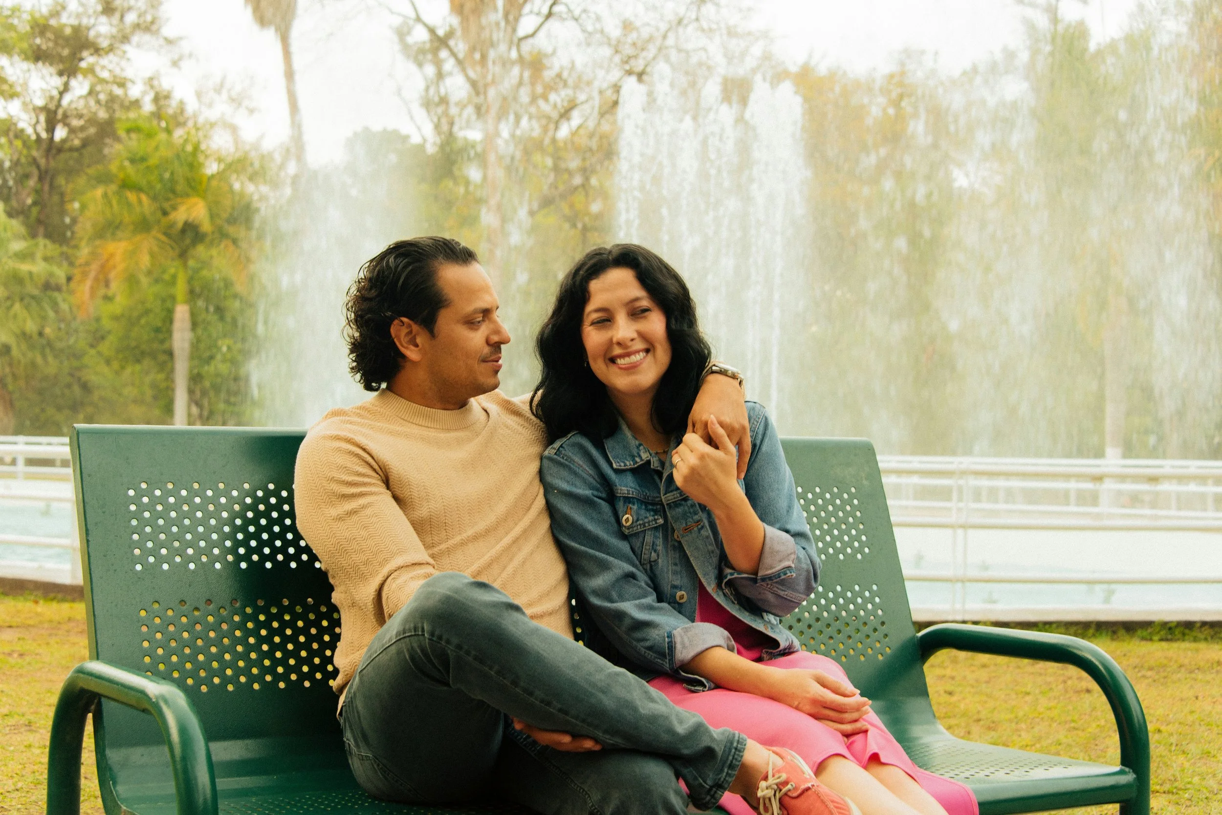 Couple sitting together on a park bench, reflecting connection and clarity for partners considering discernment counseling in Houston while unsure about divorce.