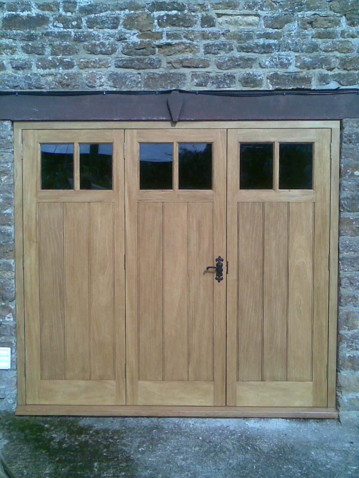 bi-folding garage doors in idigbo hardwood