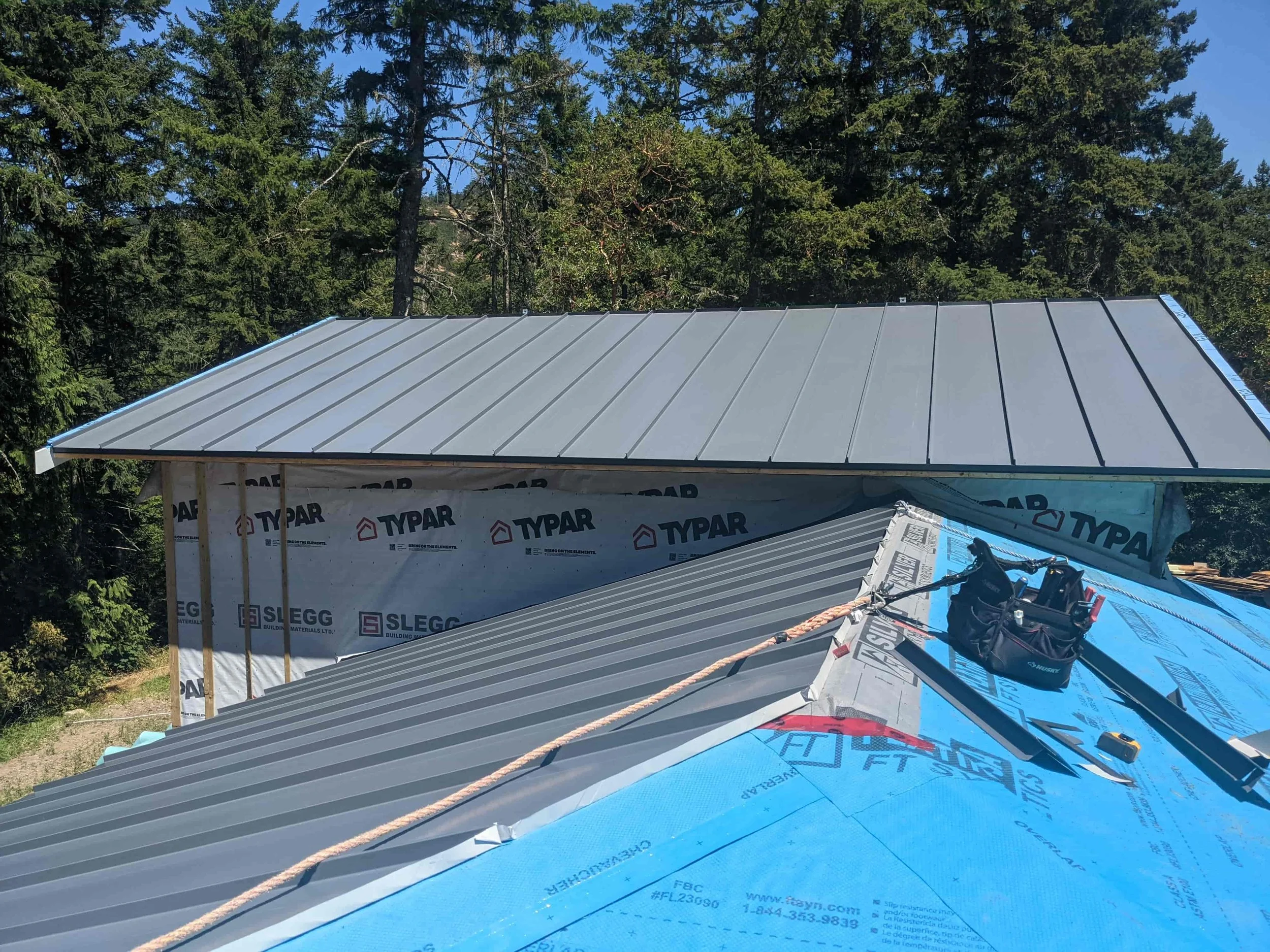 Metal roof in progress on residential building. 