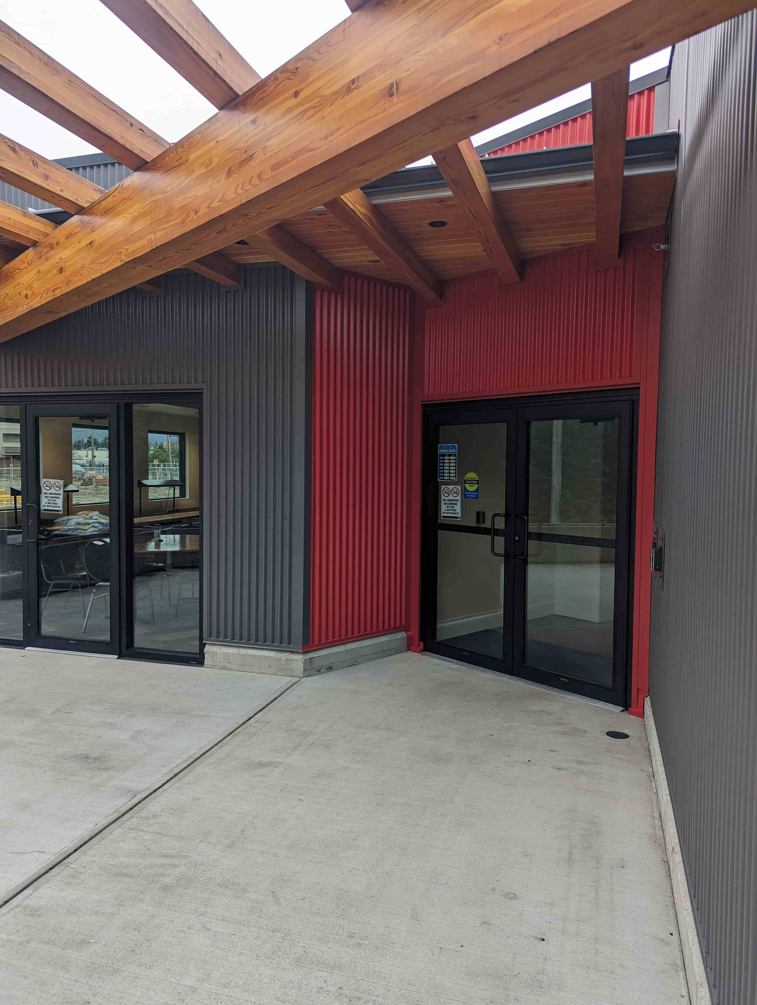 Grey and red corrugated siding on business on Vancouver Island, BC. 