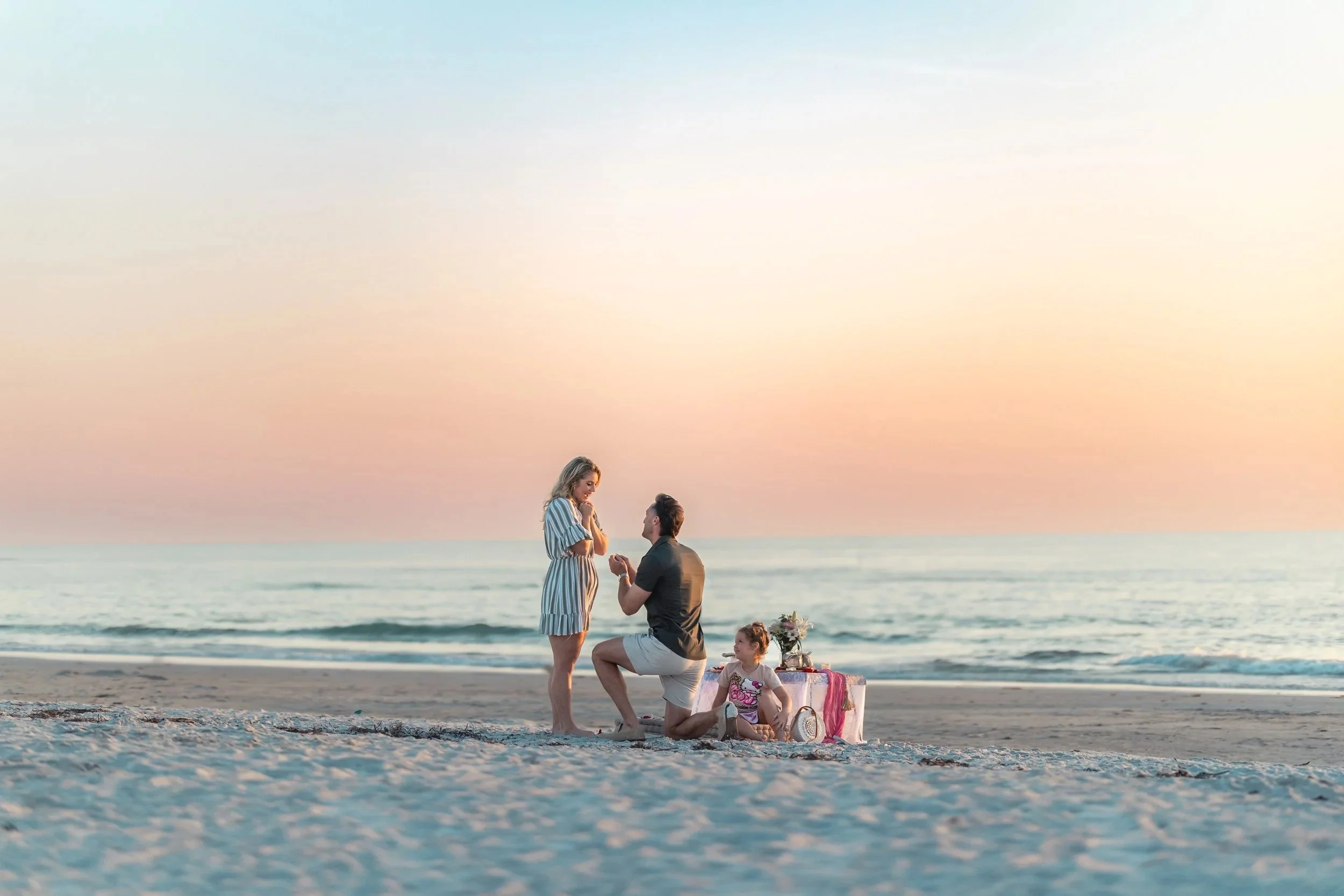couple proposing at indian rocks beach florida photography engagement session